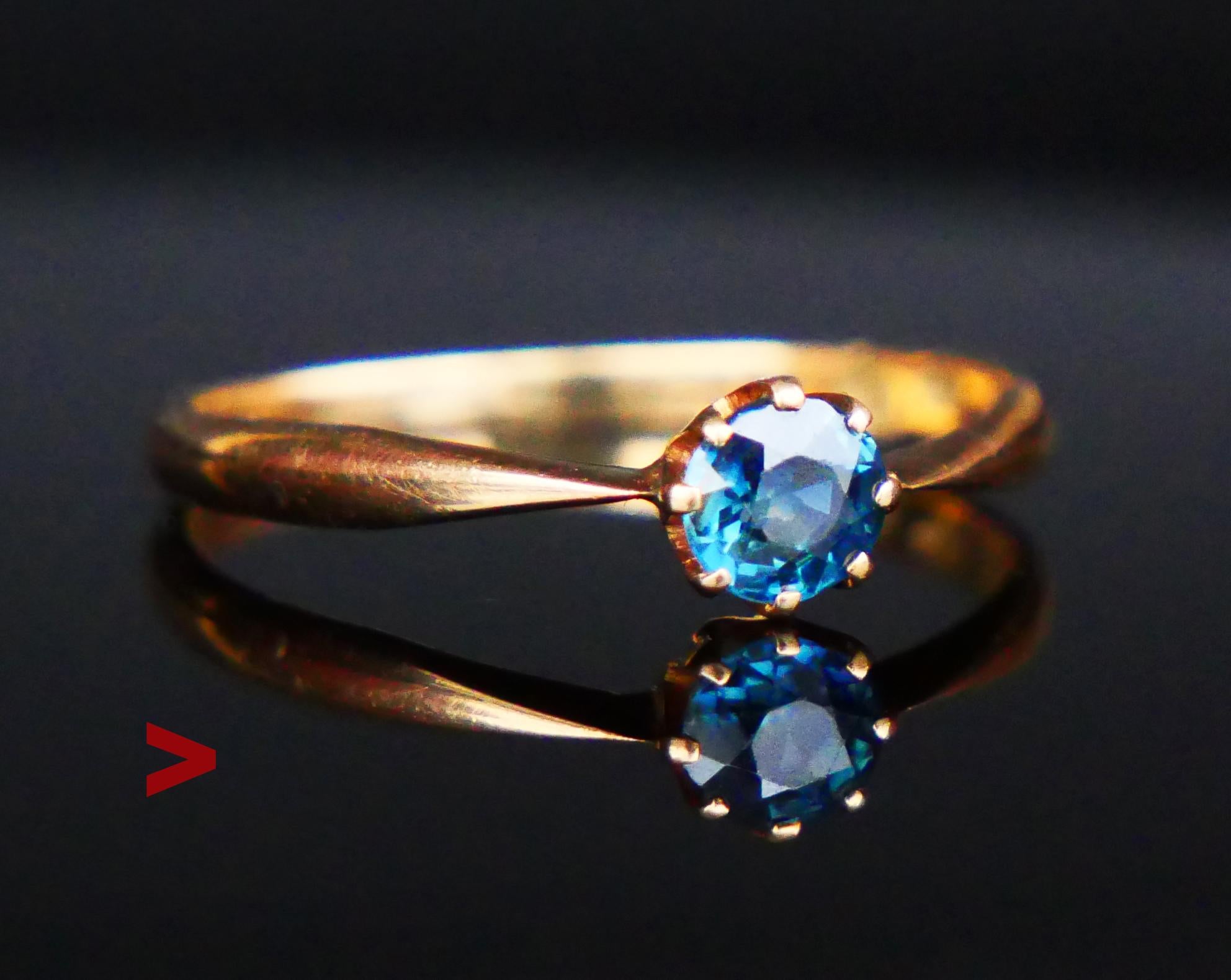 A Ring with plain shoulders featuring a claw set natural Blue Sapphire old European diamond cut 4.5mm x 2.85 mm deep / ca. 0.5 ct. Blue Color of medium intensity with tint of Green. Stone demonstrates internal structure typical for