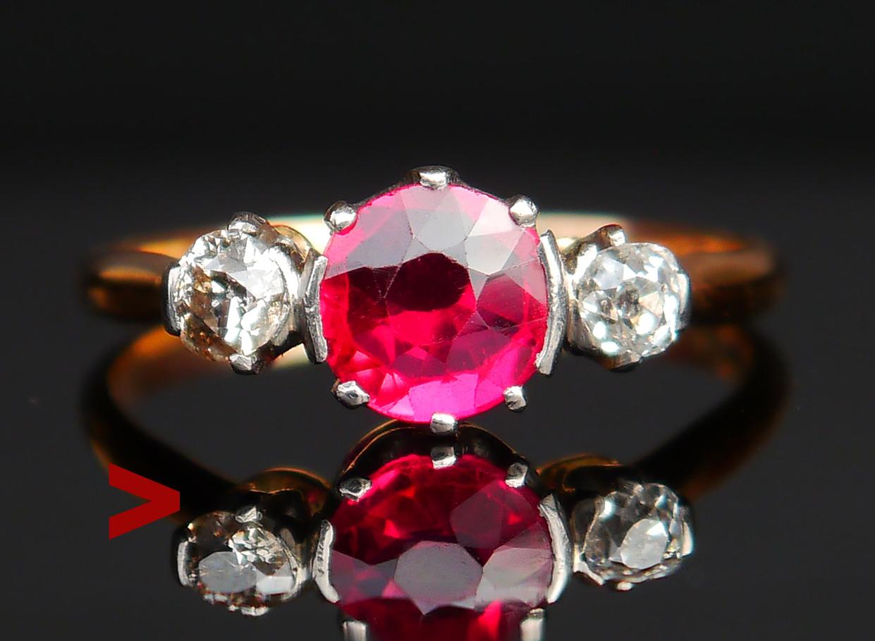 Beautiful Three - stones Ring hand - made in 1918. In finest used condition after 106 years of existence :)

Band with plain shoulders in solid 18ct Yellow Gold crown featuring platinum claw setting with Red Ruby ( lab made ) stone Ø 6.75 / ca. 1.25
