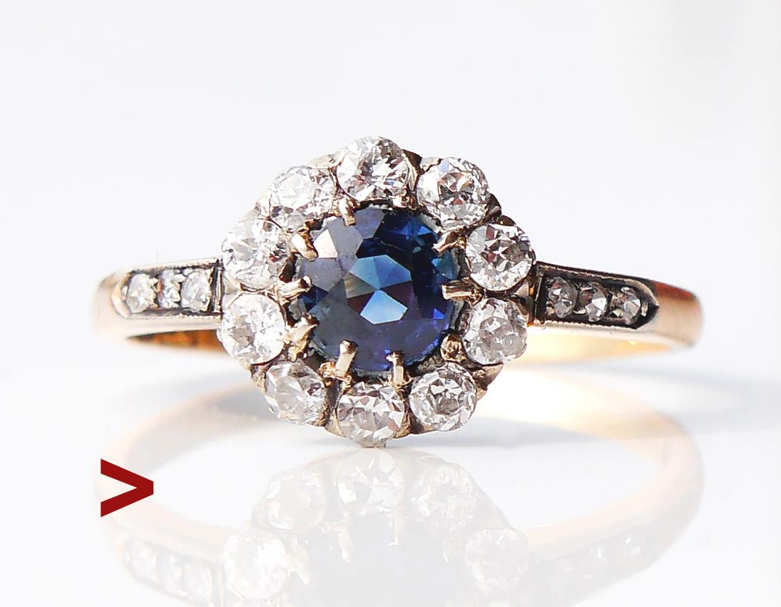 Beautiful more than century old Halo Ring in solid 18K Yellow Gold with natural and untreated Blue Sapphire and 16 old European cut Diamonds in White Gold or Silver settings.

Untreated natural Sapphire of old European diamond cut, color is Blue of