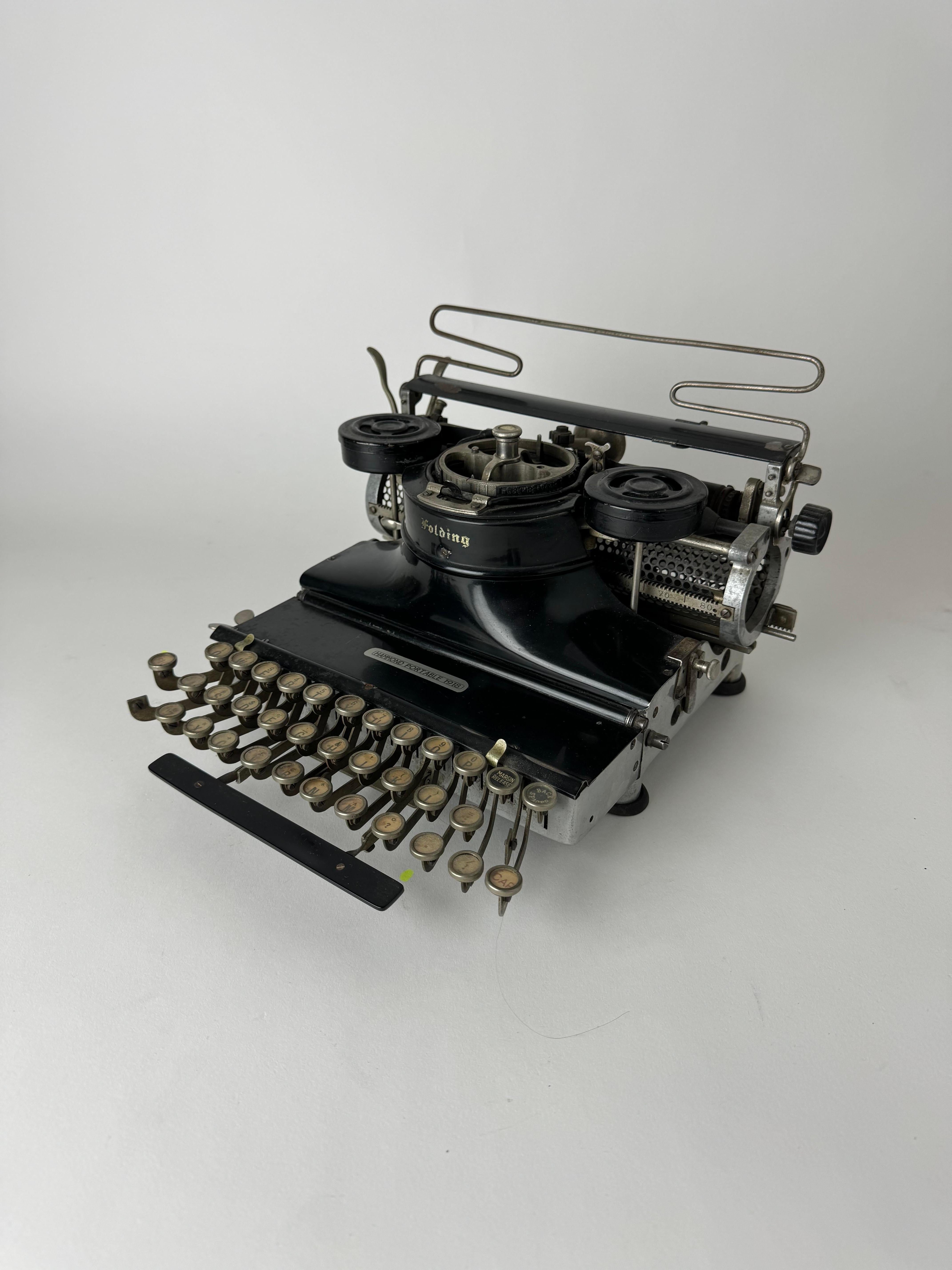 For sale we have a beautiful antique typewriter. This 1918 Antique Hammond Folding typewriter is a great relic from the early 20the century that will add cool industrial detail to your interior. 

All the parts on this Hammond typewriter are moving