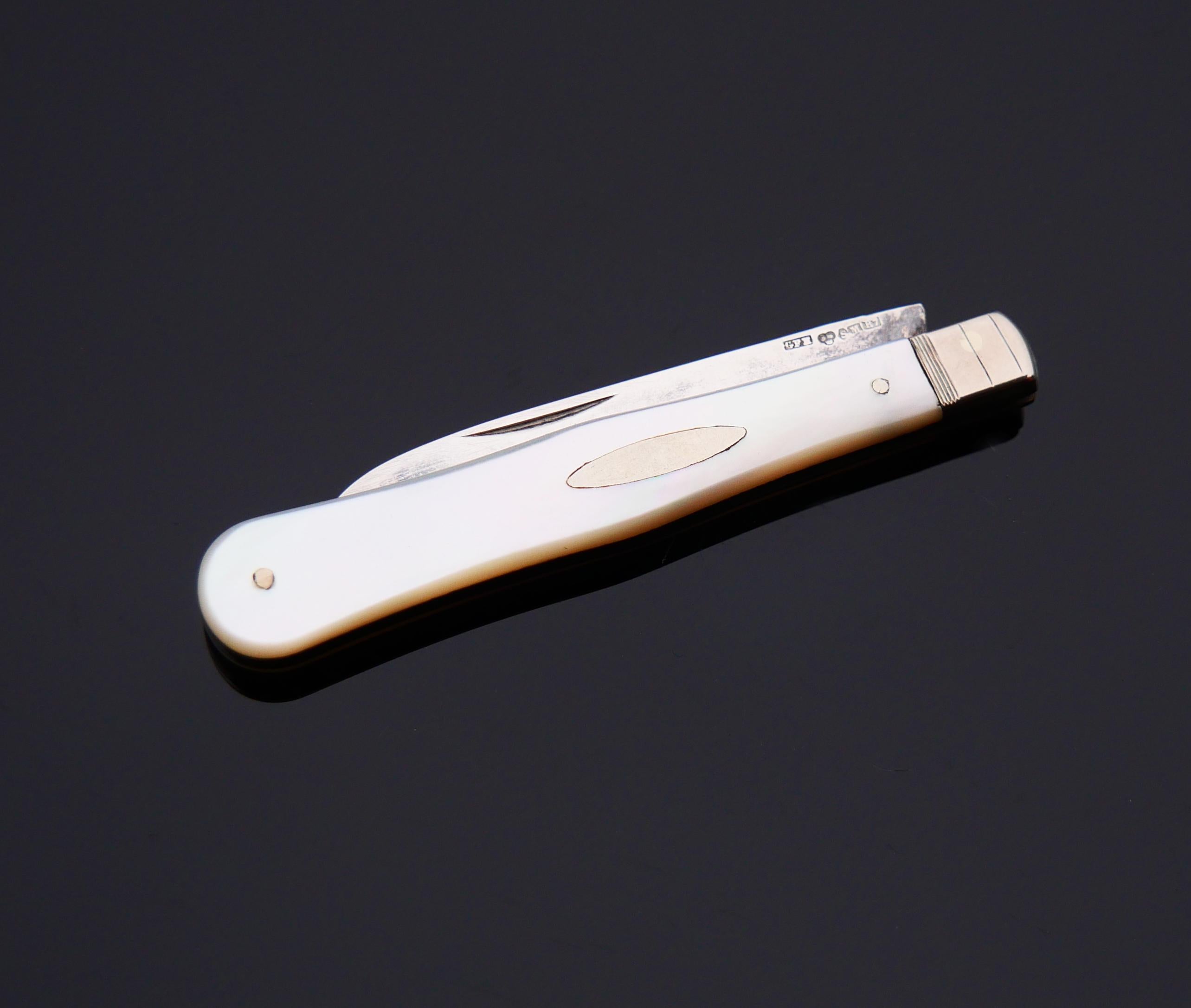 Old Fruit /pocket Knife with a folding blade in Silver and parts of the handle made of Mother of Pearl.

Hand-made in Sweden. Hallmarks on the blade: maker's, at least 830 Silver, city of Malmo, year combination R7 /hand - made in 1919.

Measures