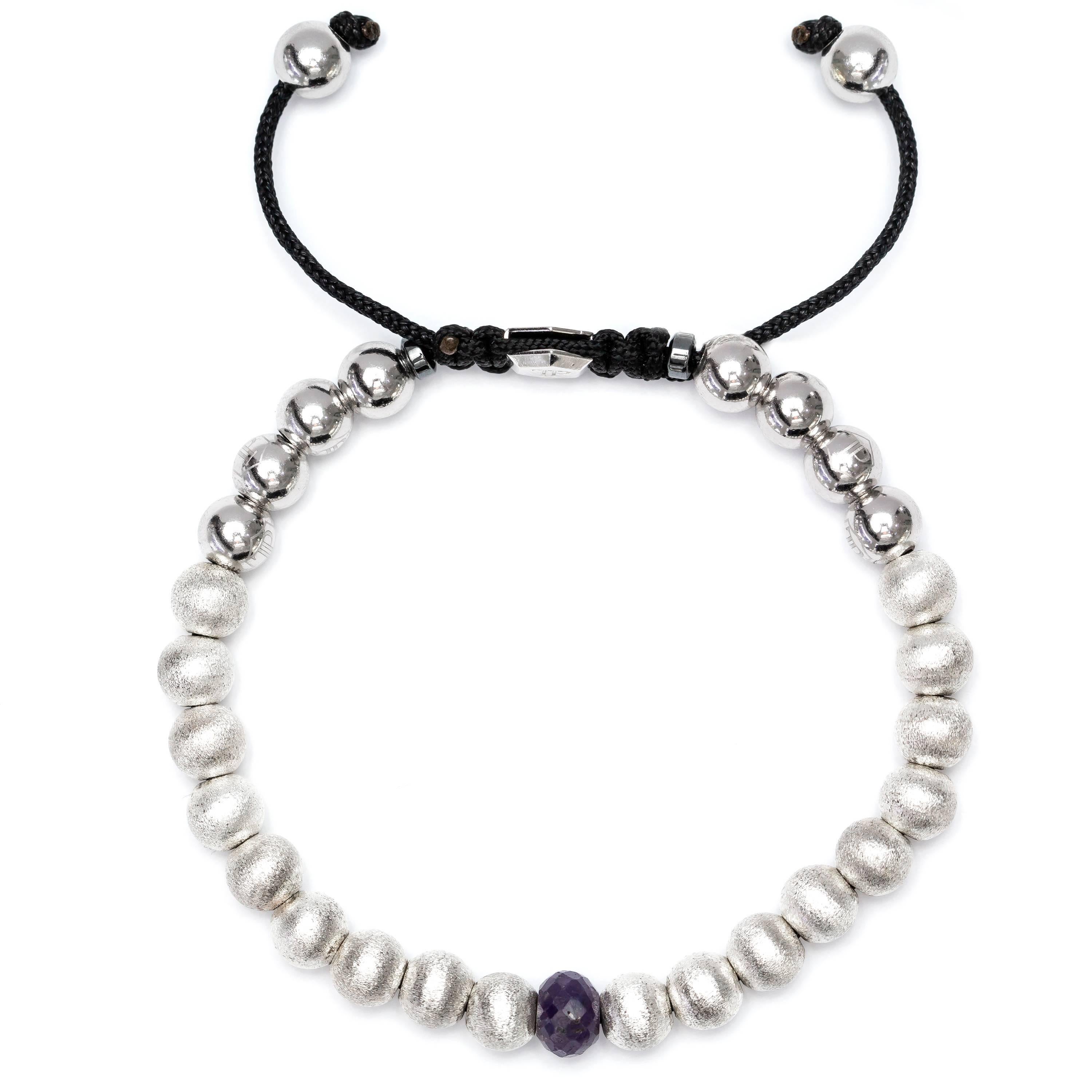 This 1.91 Carat Blue Sapphire Stainless Steel and Silver beaded bracelet from The Original Tresor Paris Caresse Blue Collection. This Bracelet features 18 satin beads and 8 Stainless Steel beads and two Magnetite rings with a Silver Hexagon Tresor