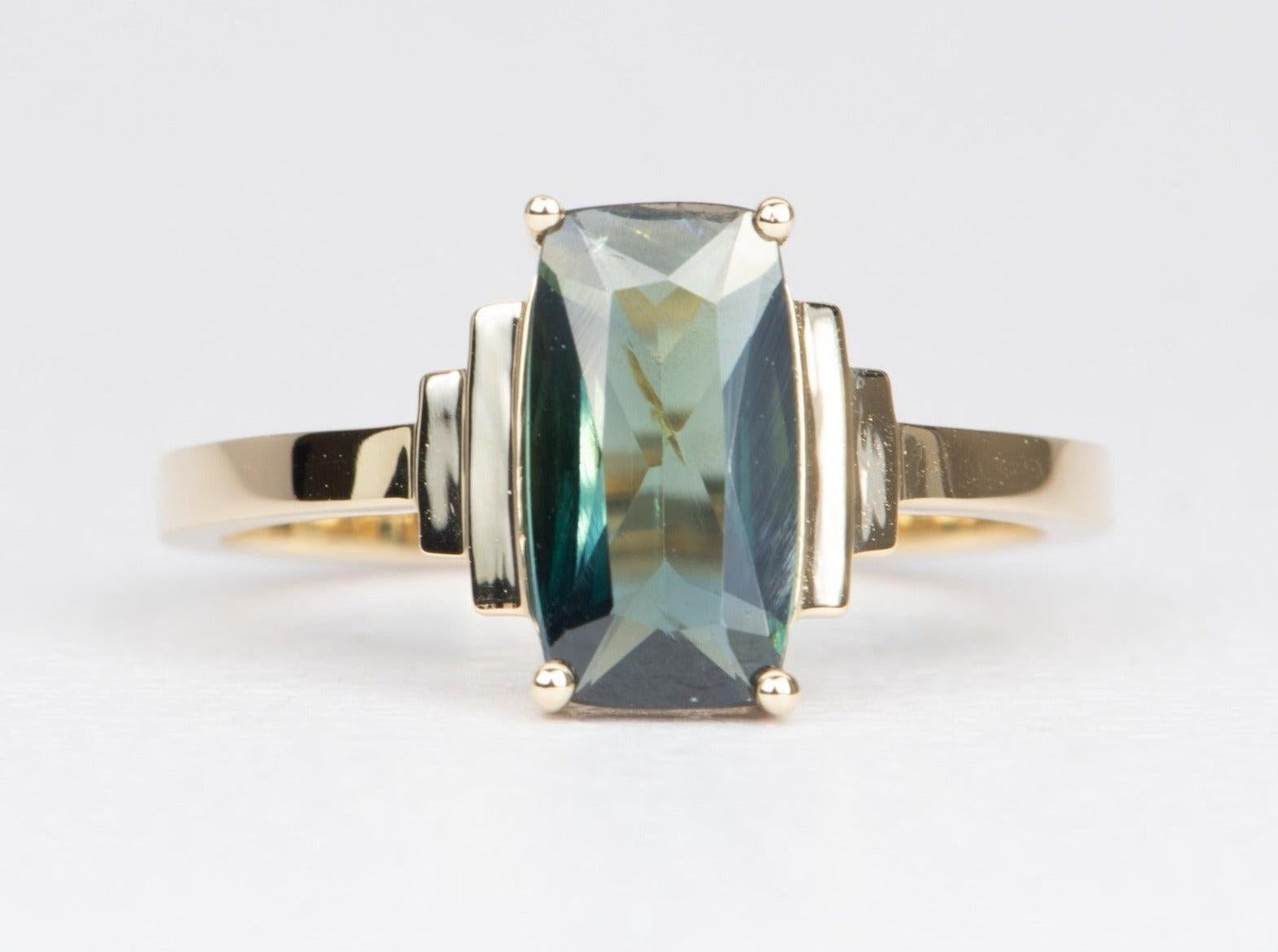 ♥ Solid 14k yellow gold engagement ring set with a beautiful teal blue Nigerian sapphire
��♥ Gorgeous blue green color!
♥ The item measures 11 mm in length, 10.5 mm in width, and stands 3.7 mm from the finger

♥ US Size 8 (Free resizing up or down 1