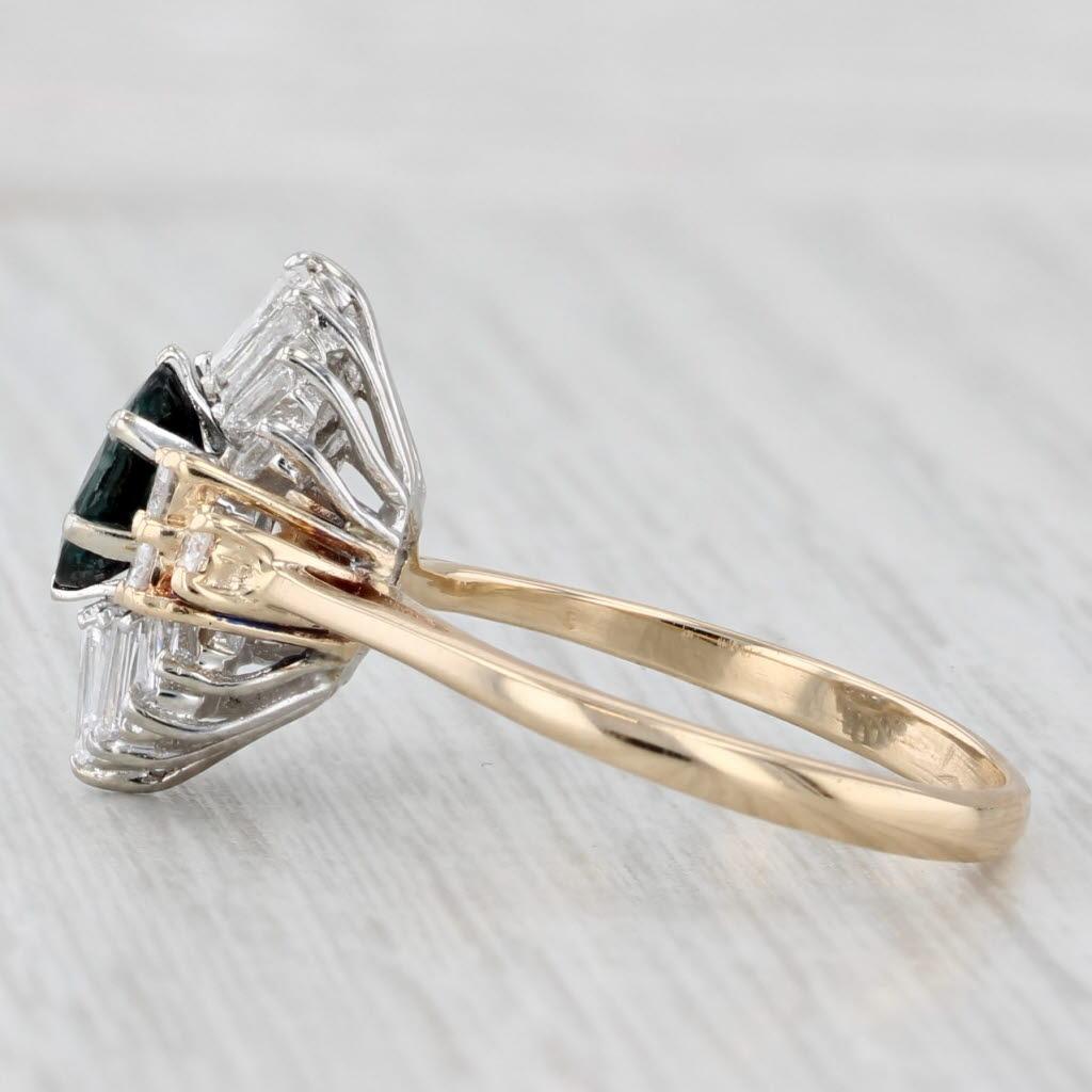 Gemstone Information:
- Natural Sapphire -
Carats - 0.86ct 
Cut - Oval Brilliant
Color - Dark Blue
Treatment - Heated

- Natural Diamonds -
Total Carats - 0.70ctw
Cut - Baguette
Color - F - G
Clarity - VS2
Please note one is chipped.

- Natural