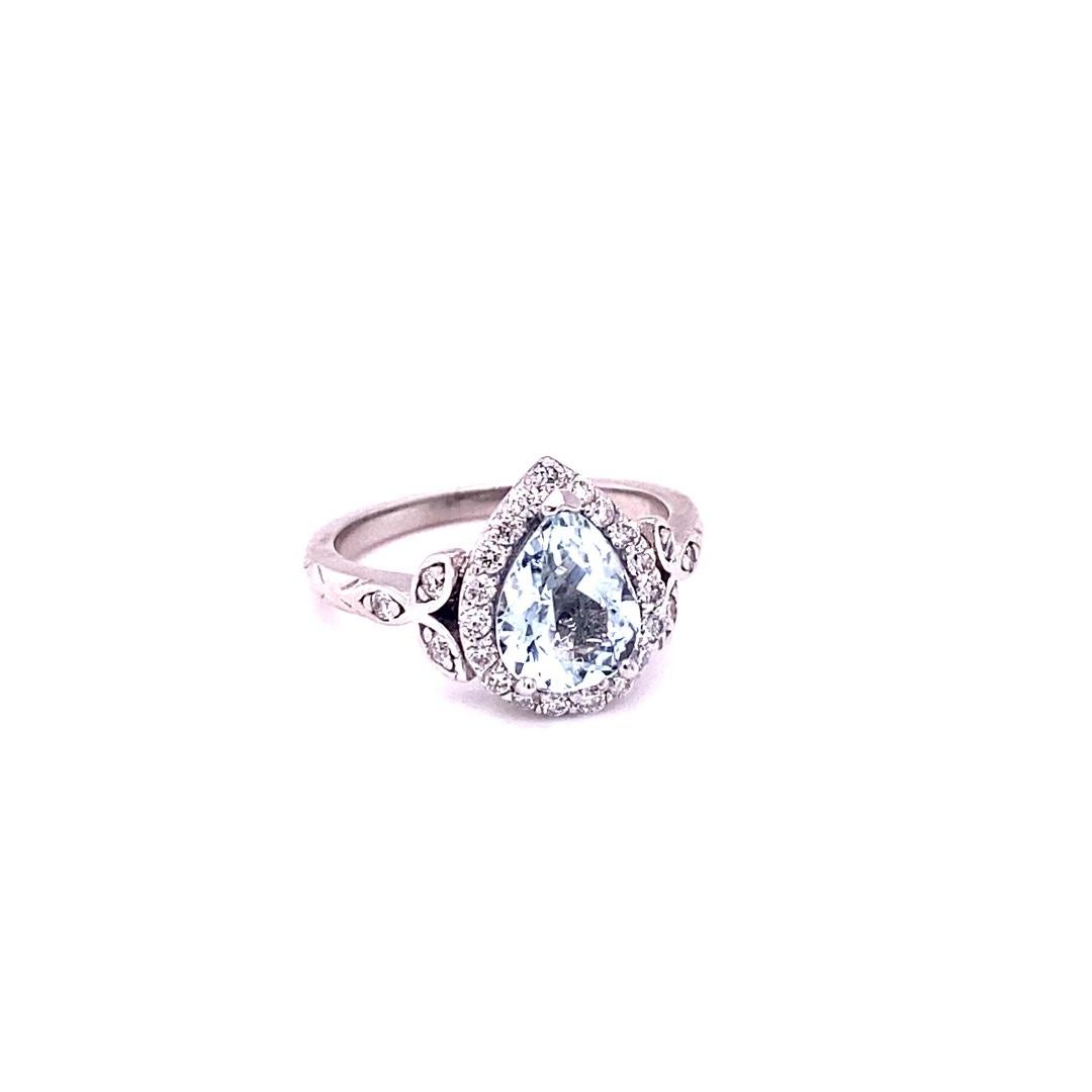 Can be a gorgeous Engagement Ring, Birthday or Anniversary Ring or simply a stunning everyday Ring! 

This ring has a gorgeous 1.52 Carat Pear Cut Aquamarine and is surrounded by 25 Round Brilliant Cut Diamonds that weigh 0.40 Carats. The Total