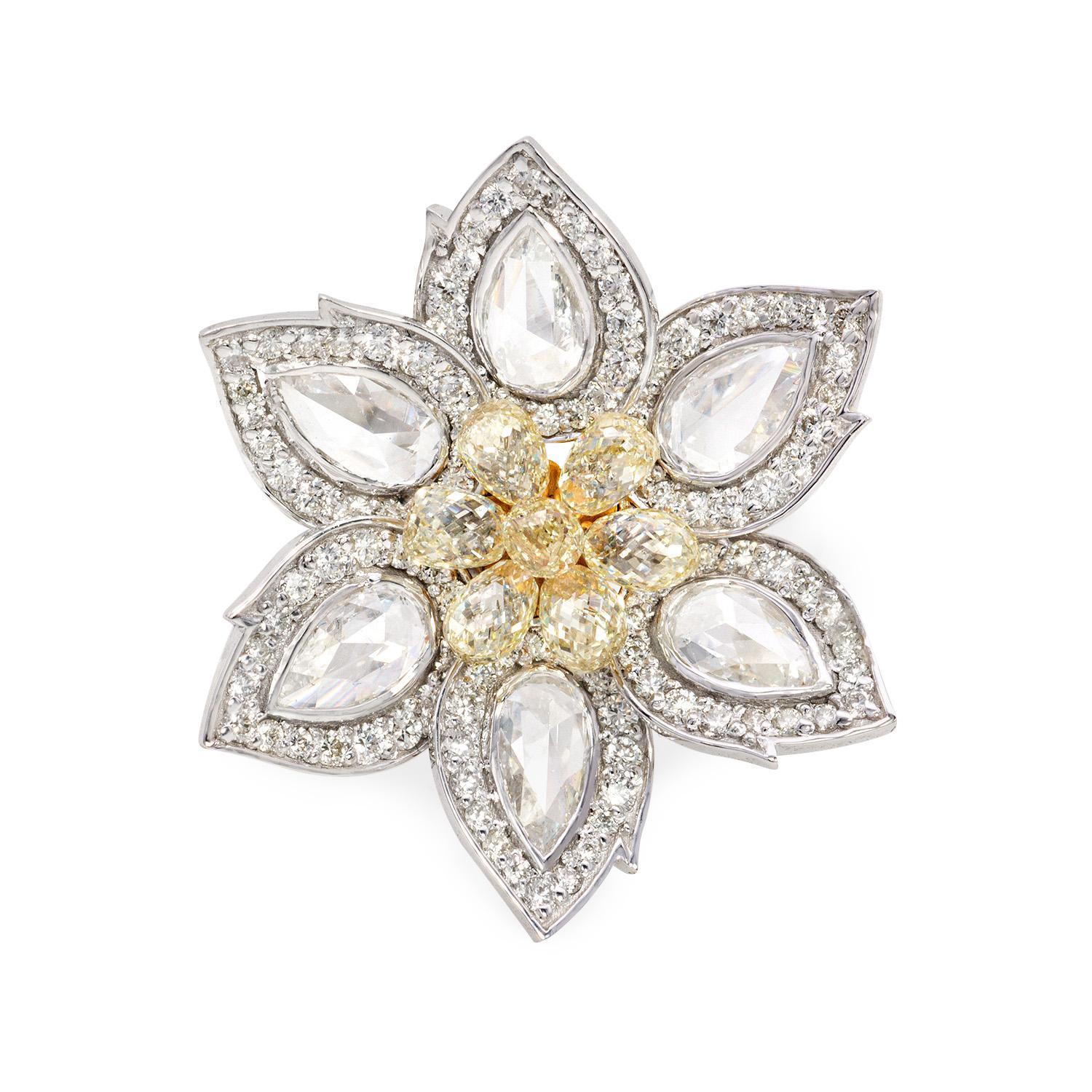The Daisy is a stunning and captivating diamond ring that exudes elegance and timeless beauty. It features a breathtaking Diamond Briolette weighing 1.92 carats, which takes center stage and captures the light with its dazzling brilliance. This