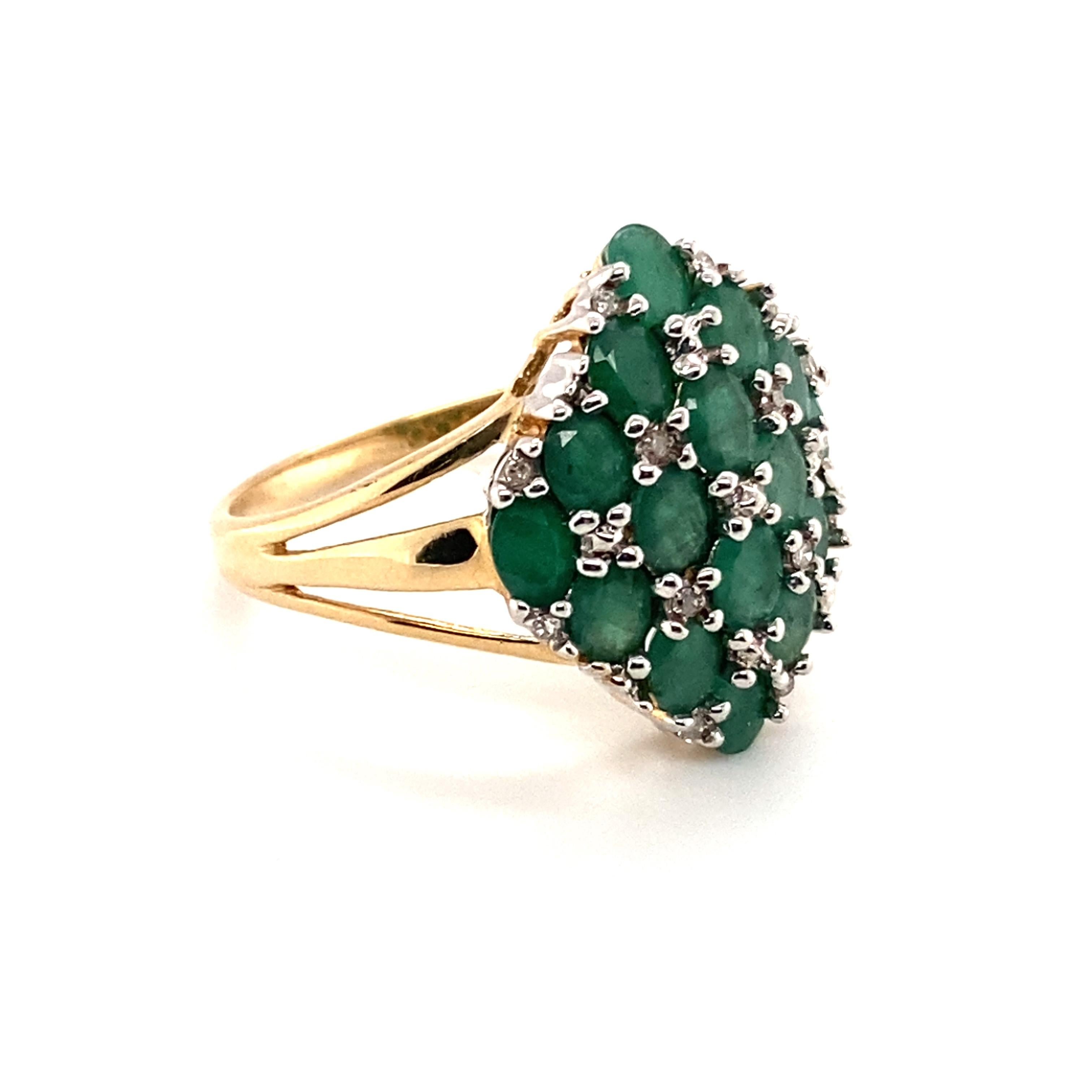 Item Features:
Gemstone: Emerald and Diamond
Metal: 14 Karat Yellow Gold 
Size: 10, sizable
Weight: 4.3 grams

Emerald Details:
Cut: Oval
Carat: 1.92 carats 
Color: Deep Green 

Diamond Details:
Carat: 0.06 carats total weight
Cut: Round 
Color: