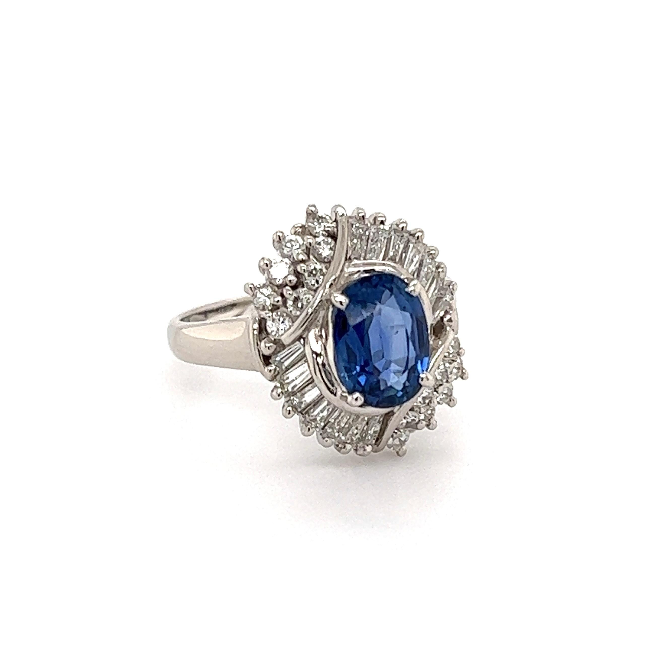 Simply Beautiful! Finely detailed Platinum Sapphire and Diamond Ring. Center securely nestled with a NO HEAT oval Australian Blue Sapphire, weighing approx. 1.92 Carats surrounded by Diamonds, weighing approx. 0.72tcw. Hand crafted in Platinum. GIA