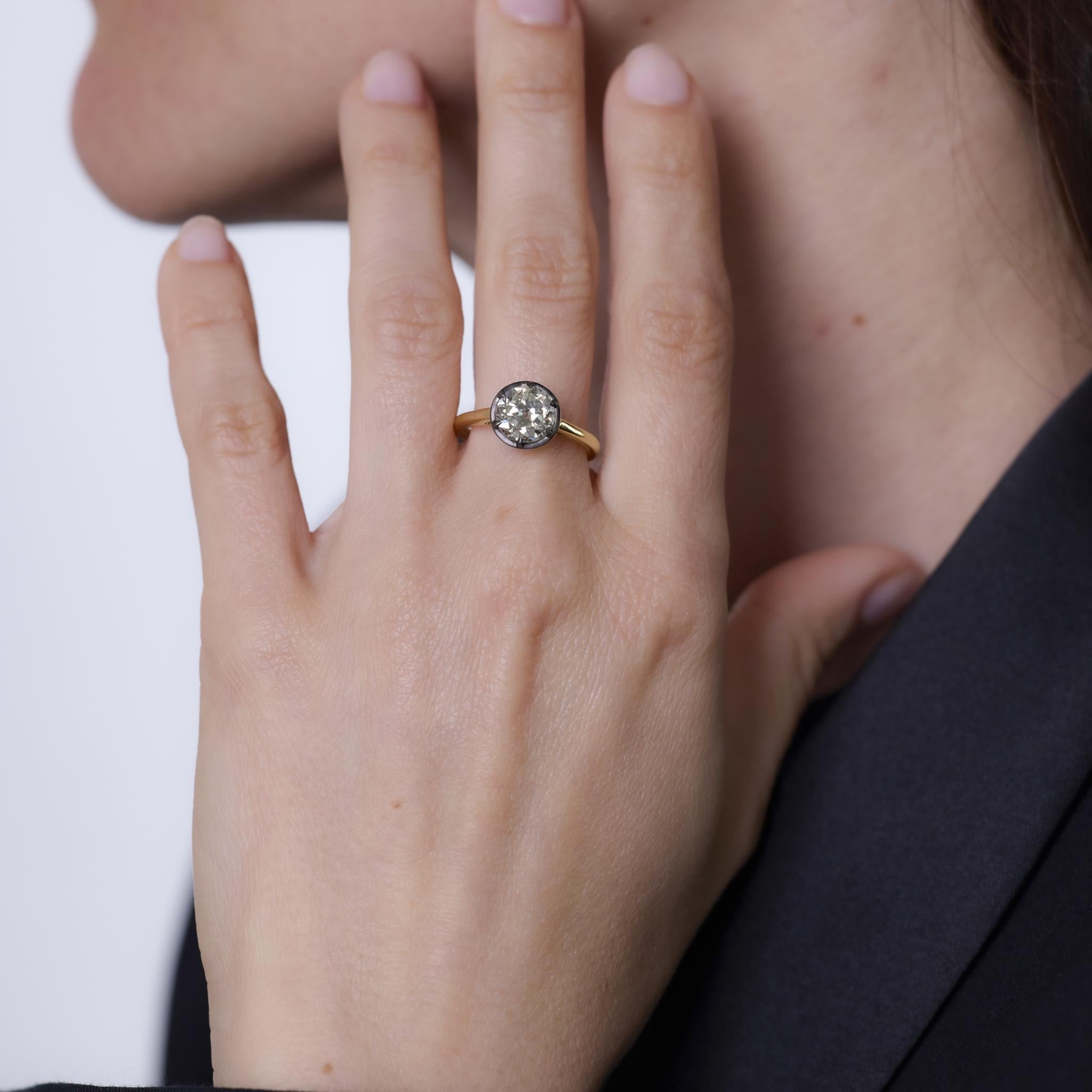 This contemporary ring features a 1.92 carat old European cut diamond set in rich 18k yellow gold, blending antique charm with a modern minimalist setting.