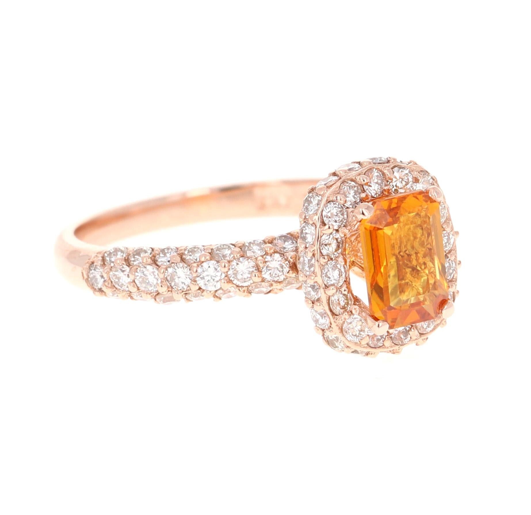 This beautiful ring has Natural Emerald Cut Orange Sapphire that weighs 1.03 Carats and is surrounded 64 Round Cut Diamonds that weigh 0.89 Carats. The total carat weight of the ring is 1.92 Carats. 

The ring is beautifully set in a classic 14