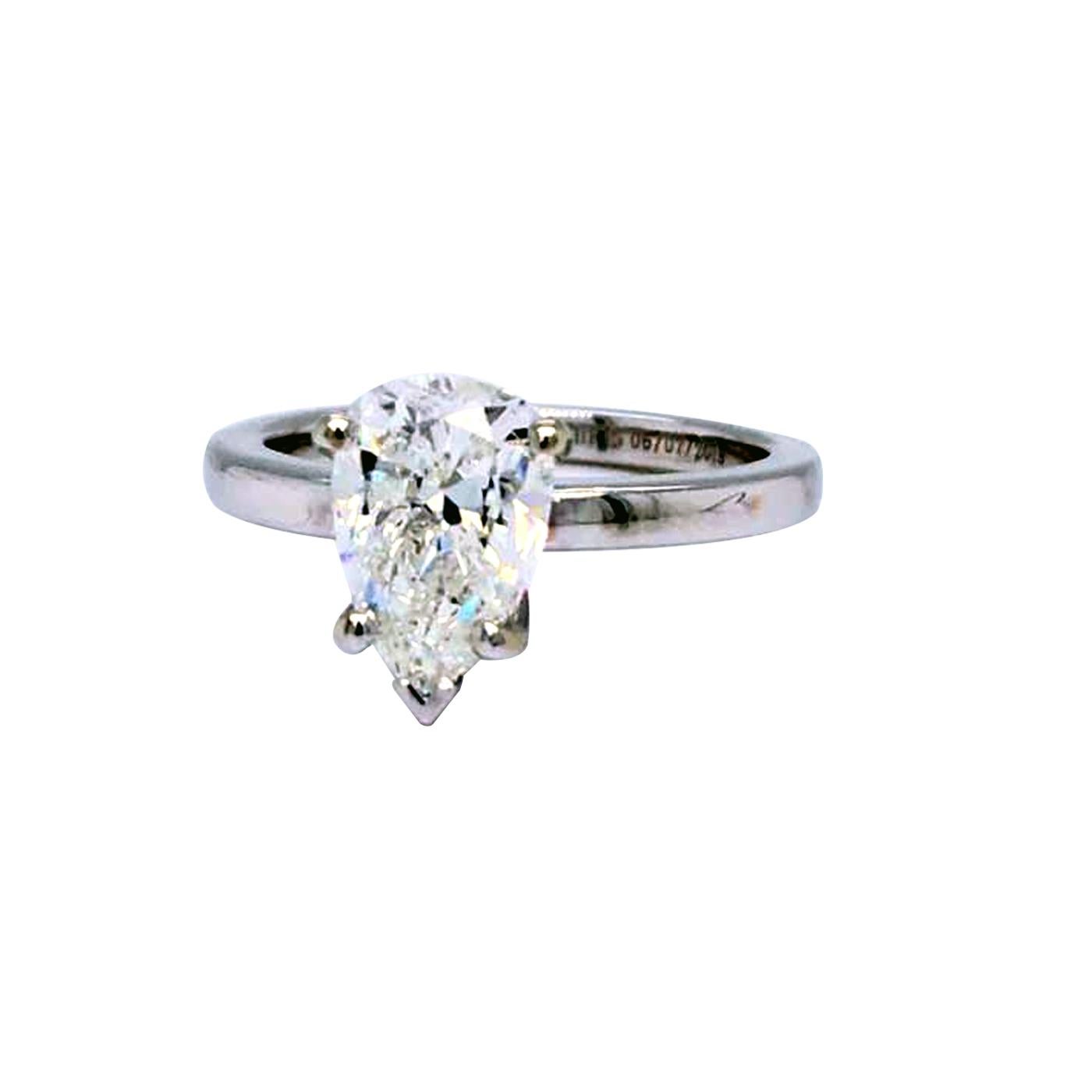 Classic Diamond ring, Sparkling, Pear Shape 1.92 carat center diamond encased with 4 prongs with G Color and Si1 Clarity with Total Weight of 1.92ct Beautiful design set in 18K White Gold ideal for weddings, engagements.

Details:
Center Carat