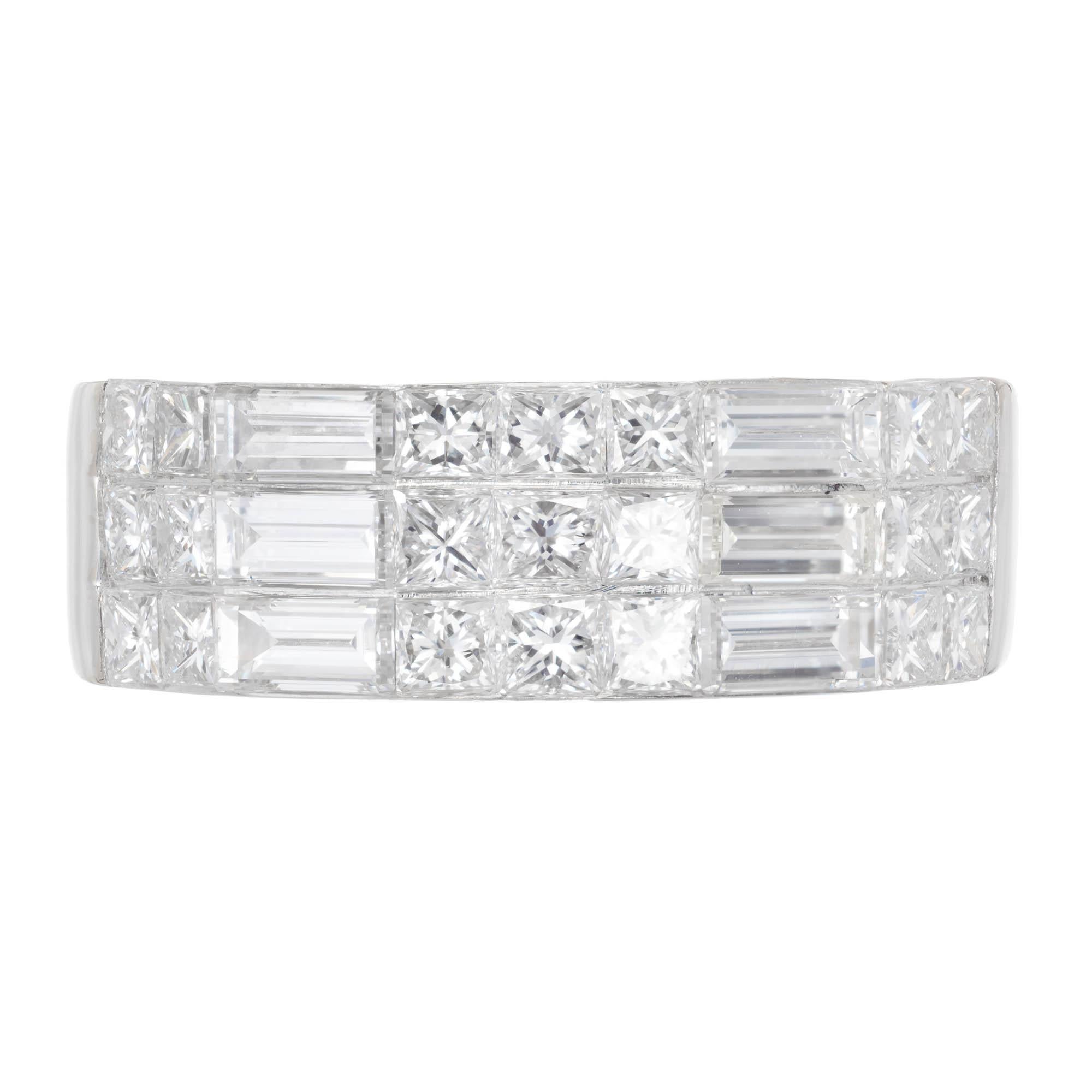 Princess and emerald cut Diamond band ring. Set in 18k white gold with 1.92cts of princess and emerald cut diamonds. Bright and great sparkle.  Not easily sizable.

21 Princess cut diamonds approx. total weight 1.20cts, E-F, VVS2, 2mm
6 emerald cut