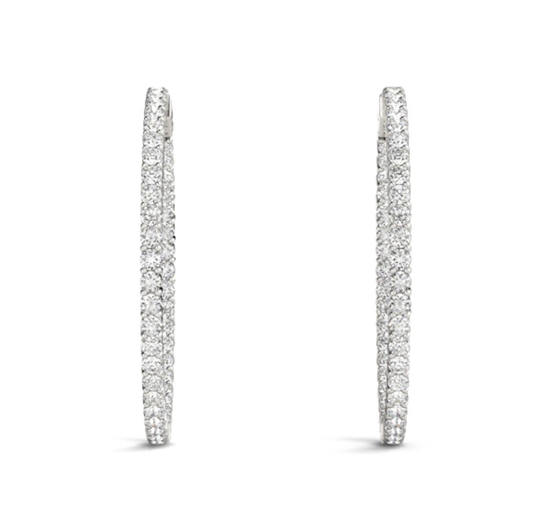 Elegant and beautiful Diamond Hoop Earrings containing 66 Round Brilliant Diamonds weighing 1.92 Carats.
Set in 14 Karat White Gold.
Measures 1.5 inches.