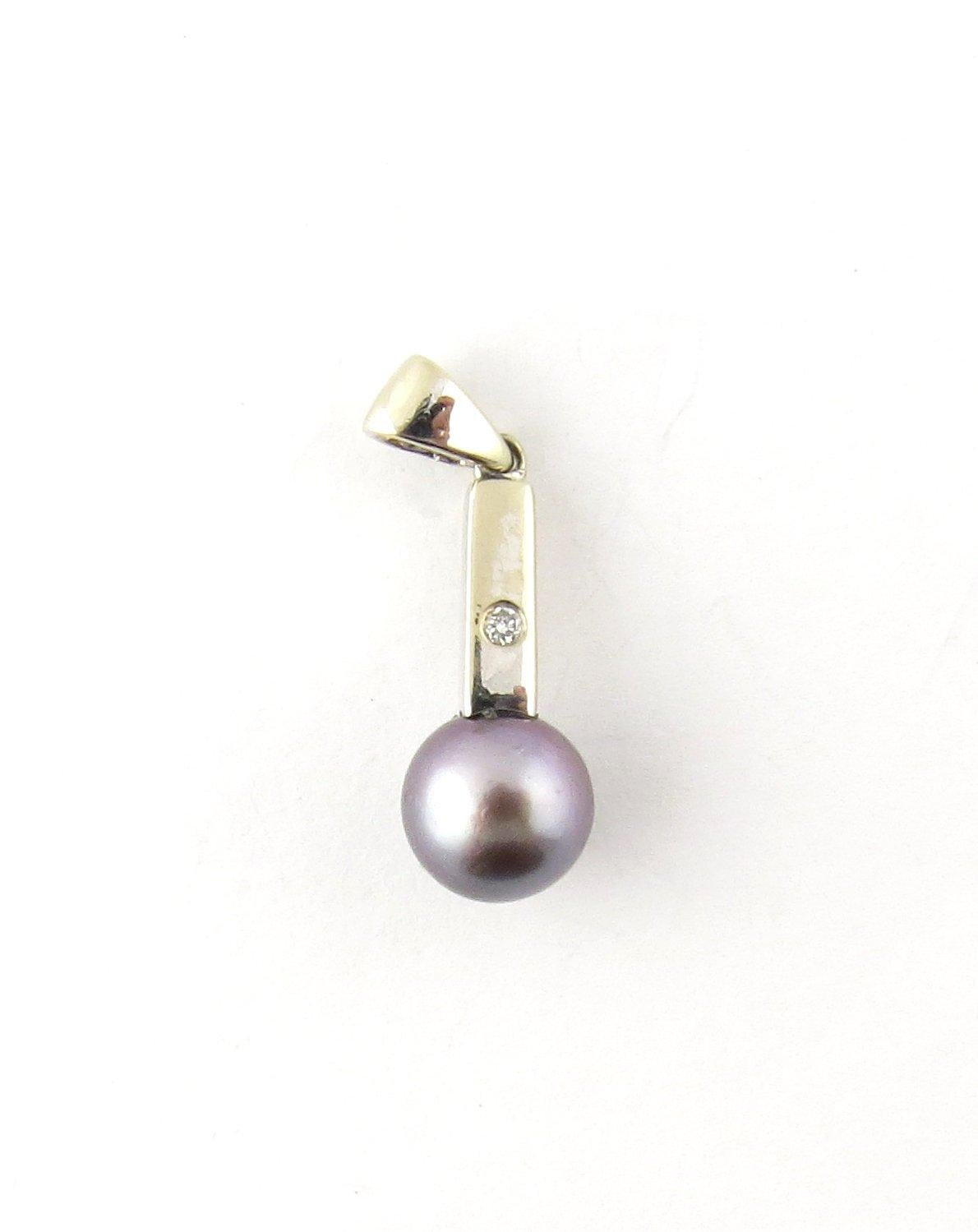 Vintage 19.2K White Gold Black Pearl and Diamond Pendant- 
This elegant pendant features one black cultured pearl (7.5 mm) accented with one round brilliant cut diamond and set in 19.2K white gold. 
Approximate total diamond weight: .01 ct. 
Diamond