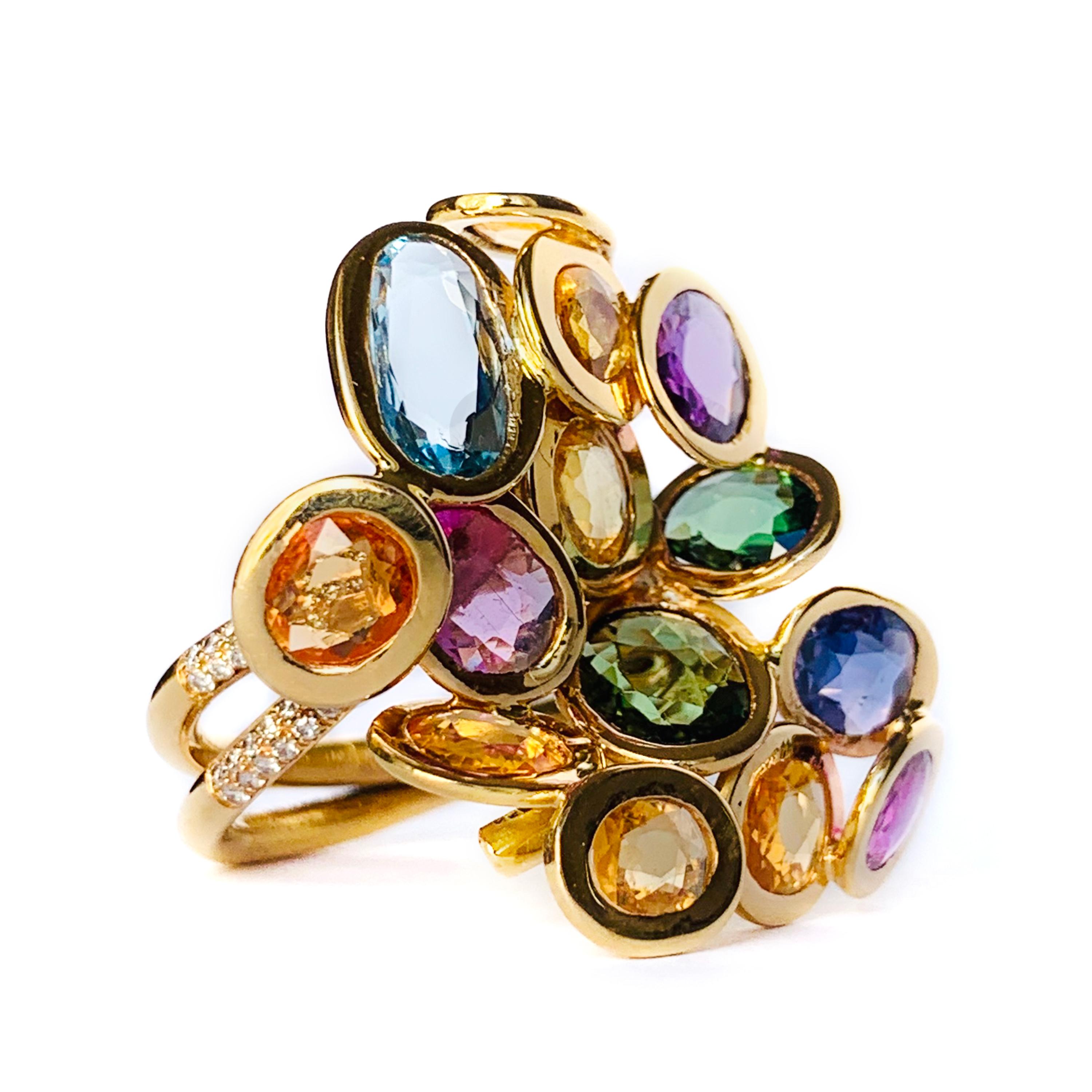 Rosior by Manuel Rosas Contemporary Ring Manufactured in 19,2k Yellow Gold and setted with Rose Cut Gemstones in a special type of setting:
- 1 aquamarine with 0,56ct,
- 10 sapphires with 5,60ct,
- 1 spinel with 0,56ct,
- 2 tourmalines with 1,12ct
-