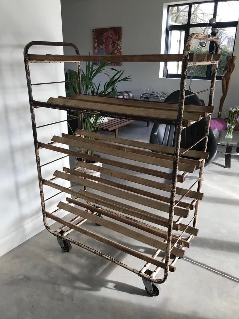 Great industrial look,

1920-1930 original vintage French bread bakery shelving unit bread rack.

This outstanding shelving comes with five shelves, we would suggest to put a glass shelf on the racks to make it a lovely useful storage rack.