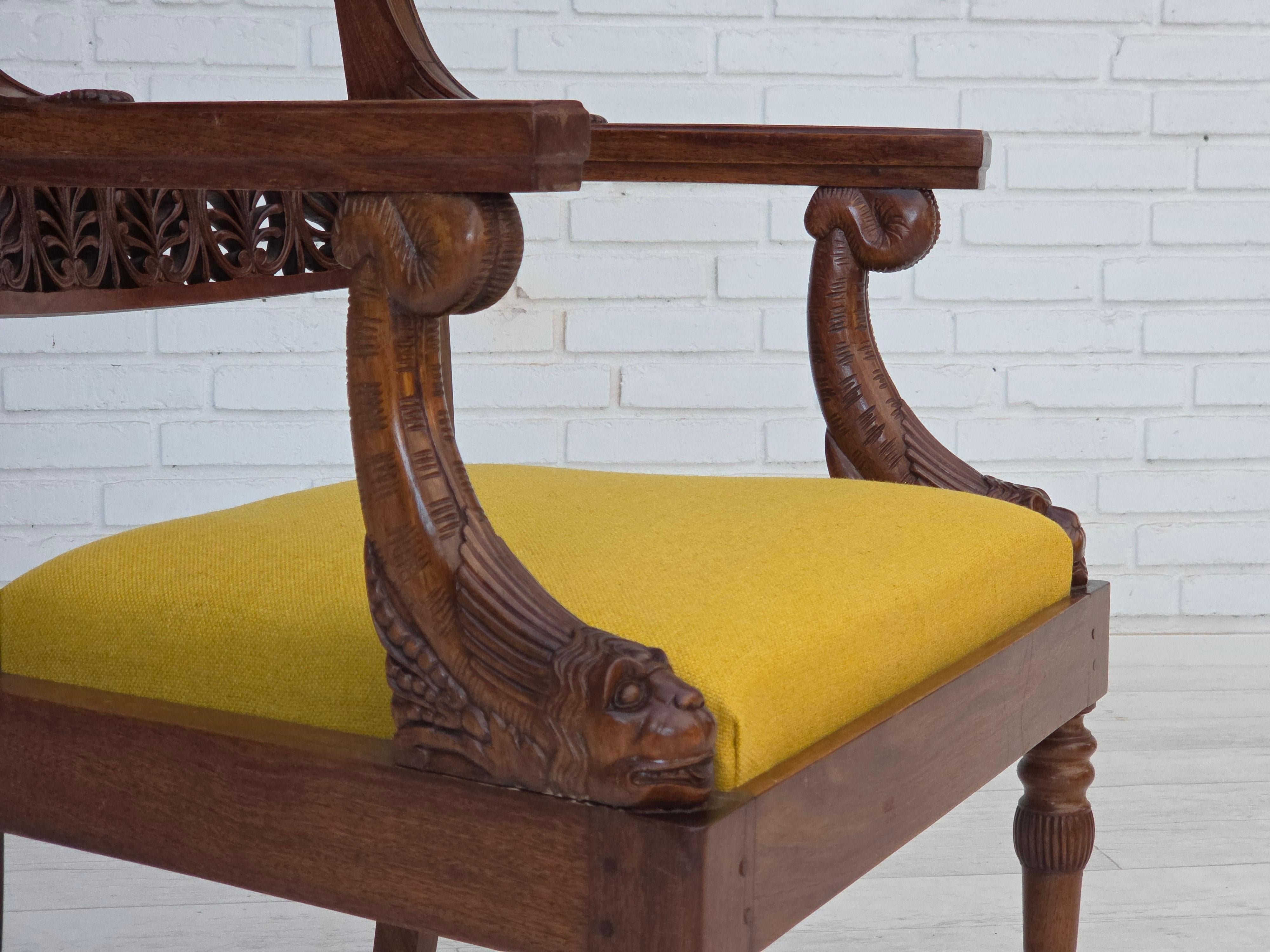 1920-30s, carved teak wood armchair. Design after Georges Jacob. Handcarved teak wood, furniture wool fabric. The chair was reupholstered by craftsman. Manufactured in about 1920-30s.