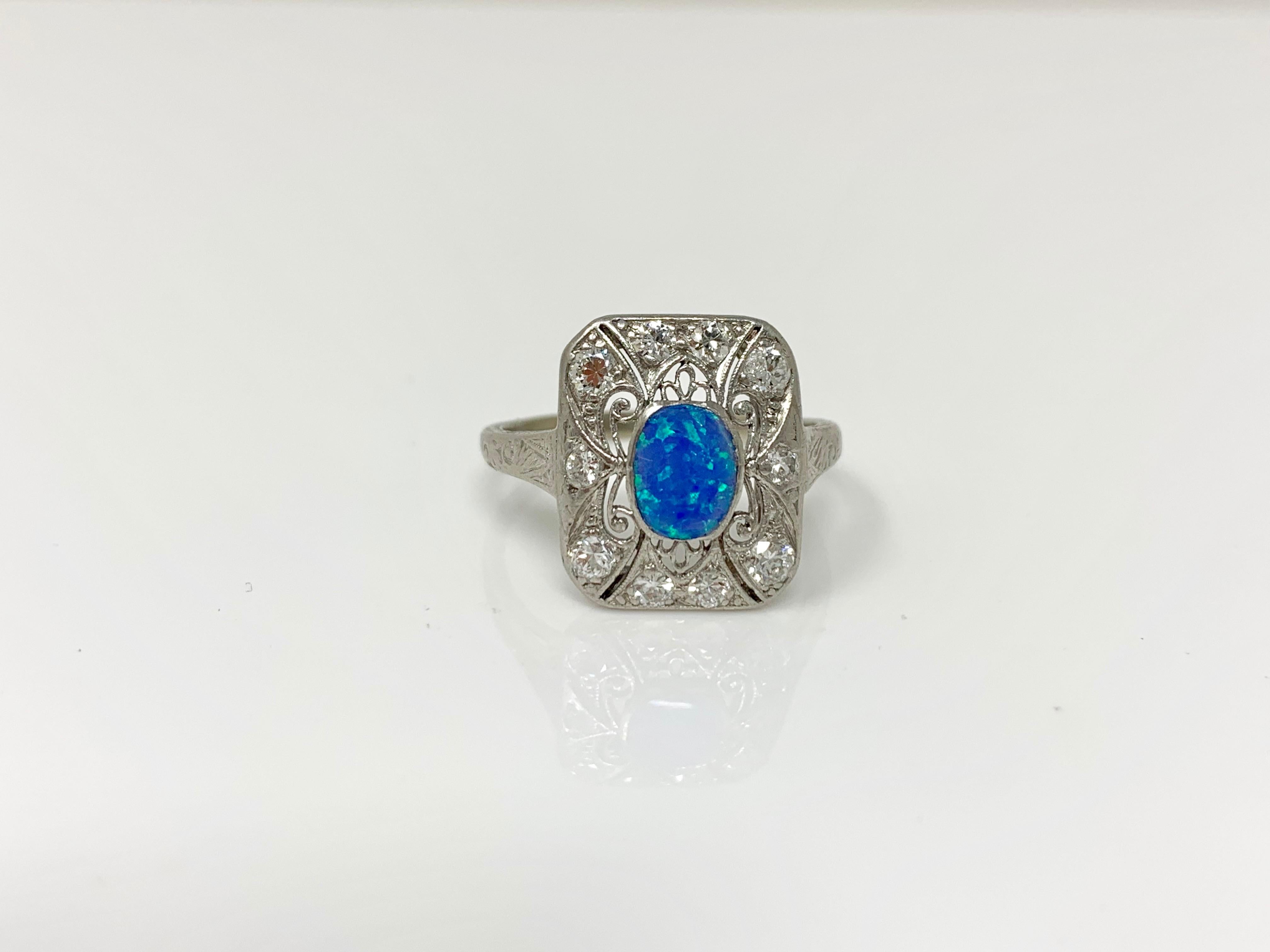 This 1920 antique opal and diamond ring is hand made in platinum. 
The details are as follows: 
Opal : 1 carat 
Diamond : 0.75 carat ( GH color and VS clarity ) 
Metal : Platinum 
Ring size : 8