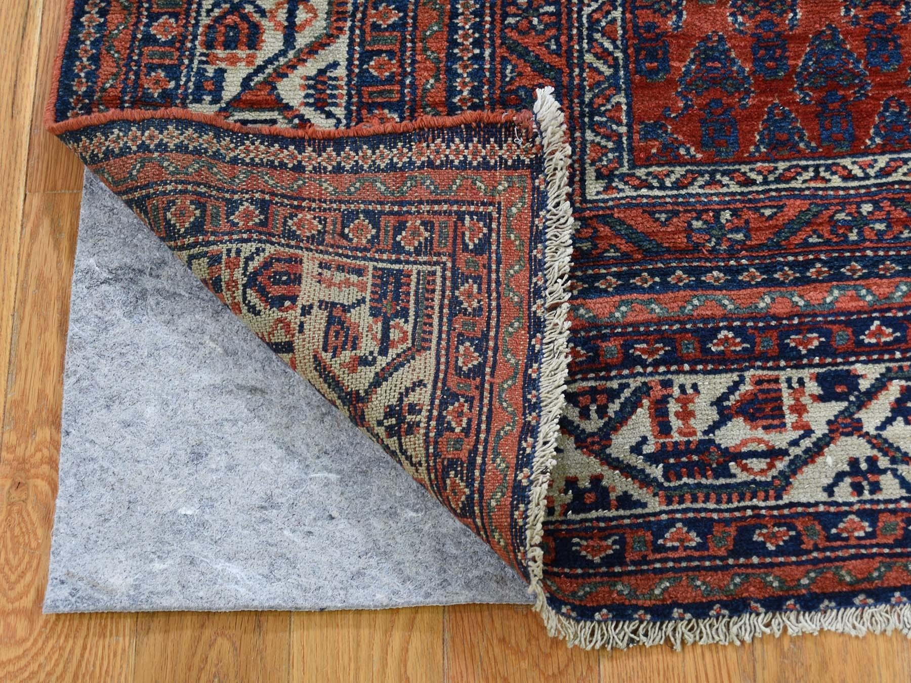 This is a genuine hand knotted oriental rug. It is not hand tufted or Machine Made rug. Our entire inventory is made of either hand knotted or handwoven rugs.

Bring life to your home with this lovely pure wool red, is an original Antique Persian