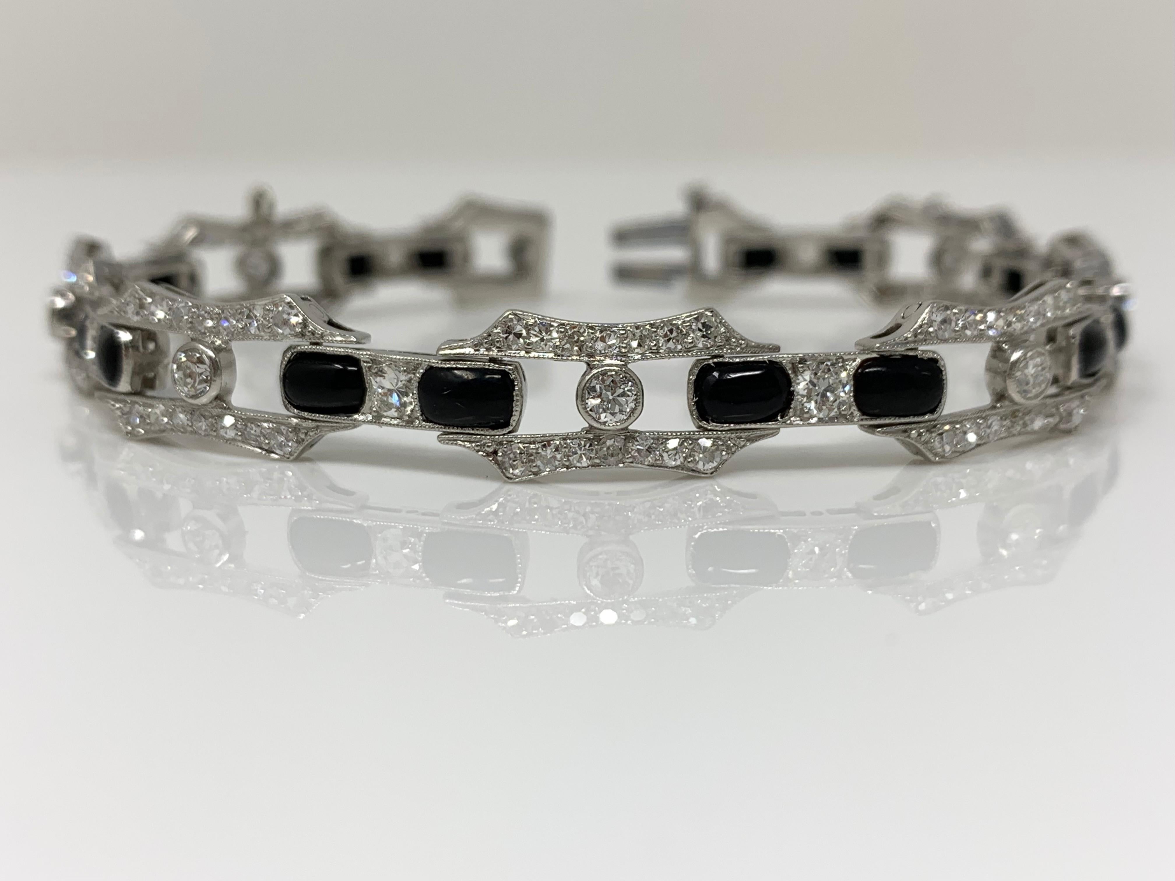 This gorgeous diamond and onyx bracelet is meticulously hand crafted in platinum. 
Diamond weight : 2 carat ( GH color and VS clarity ) 
Measurements : Length : 7 inches 