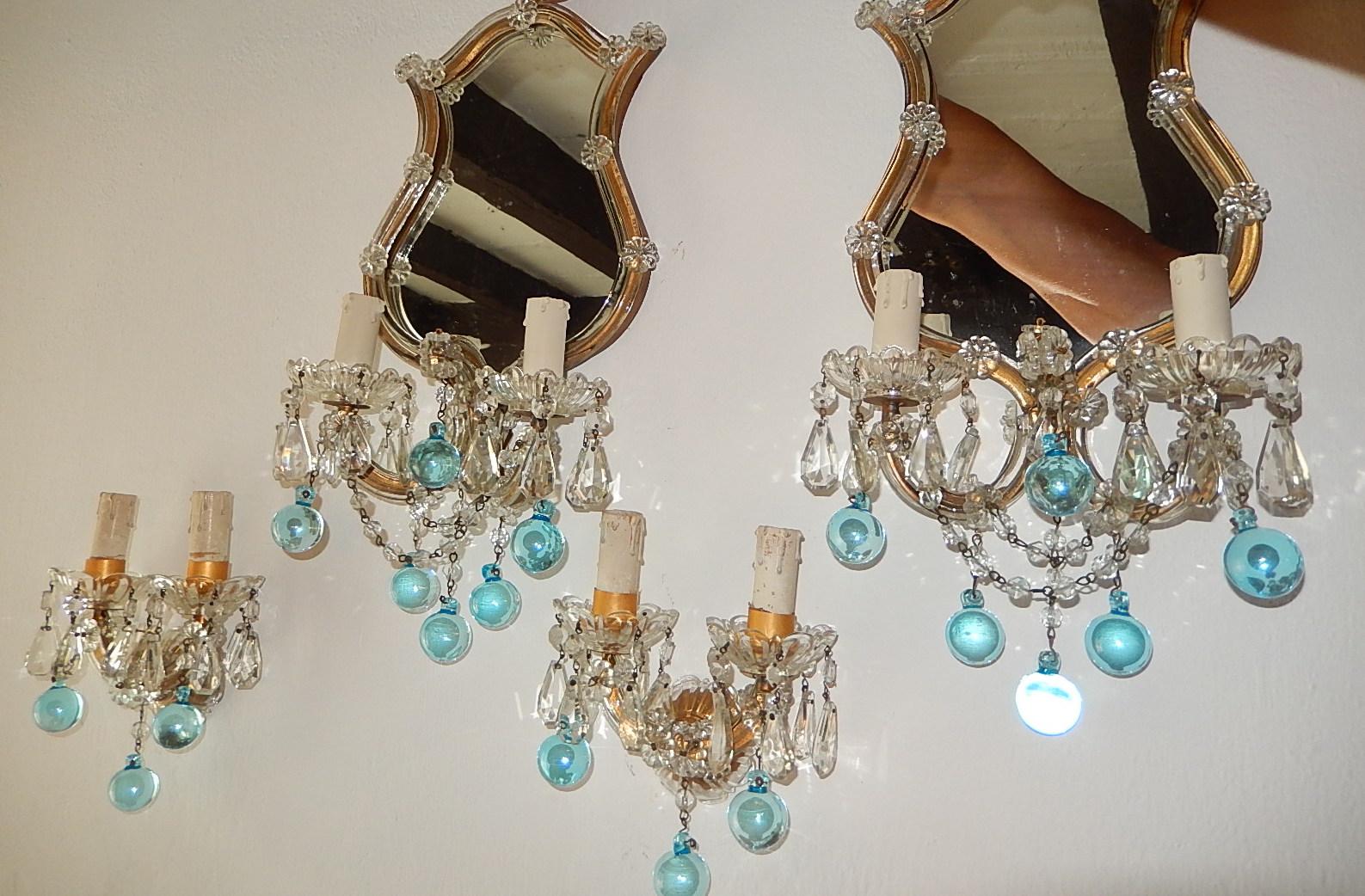 This set consists of four sconces, two with mirrors and two without. I have the matching nine-light chandelier as well. Gilt metal with Murano blown glass covering. Adorning rare aqua blue Murano balls throughout with swags of beads and crystal
