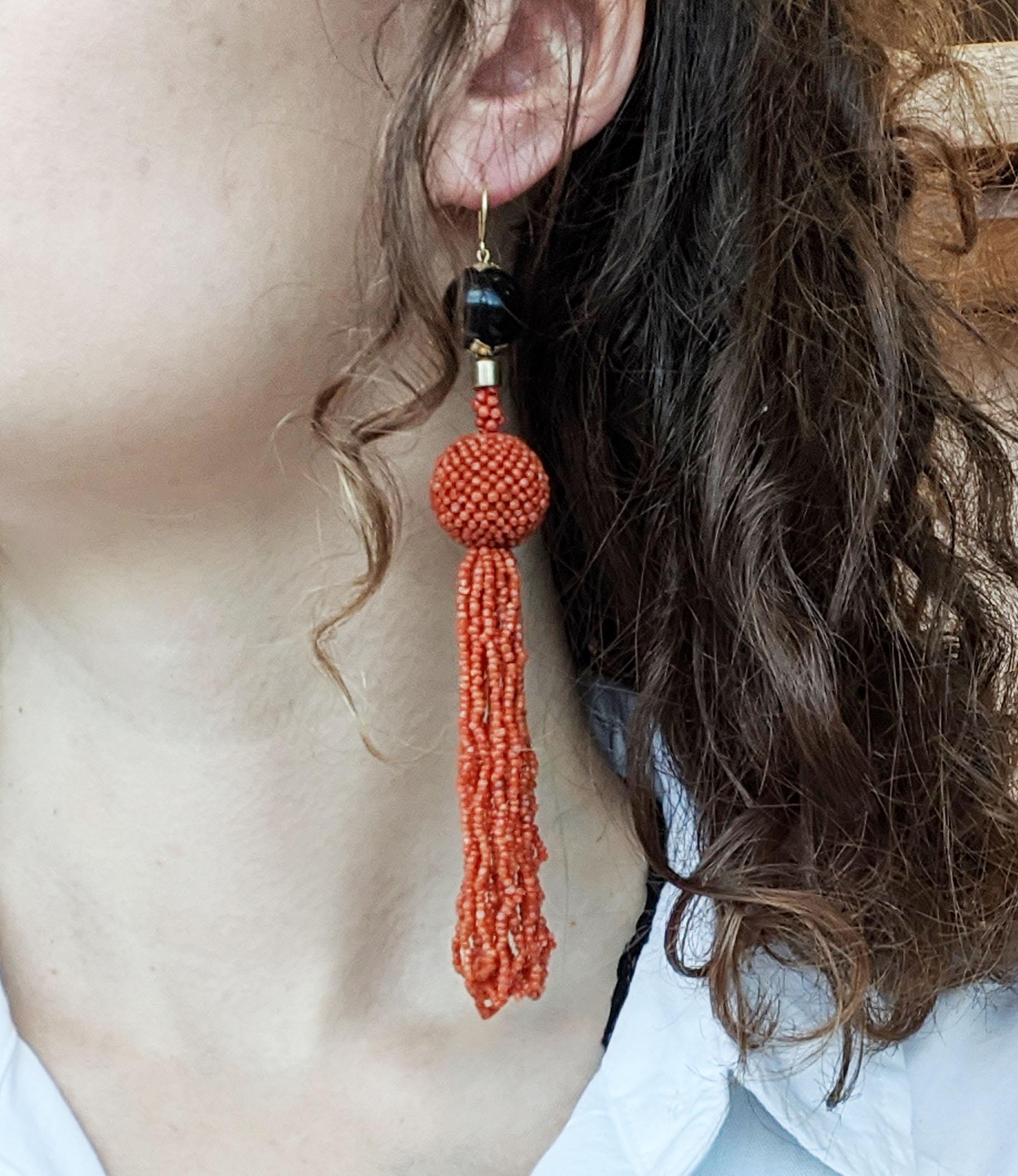 These are an incredible pair of unique Art Deco earrings in 18k yellow gold with a black onyx holding a long beaded coral looped fringes! These earrings are truly unlike any others you have seen! The dramatic combination of black and bright red,