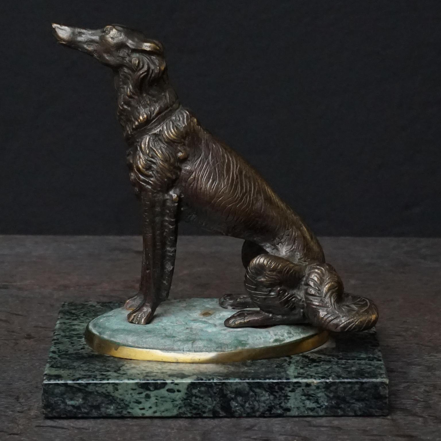 Very cute heavy French Art Deco brass borzoi dog on green marble.
Nice expression in his little face.

Very pretty and decorative, its weight (4 kilo's) would make it an excellent paperweight.

The Borzoi, Barzoi or Borzaya, also called the