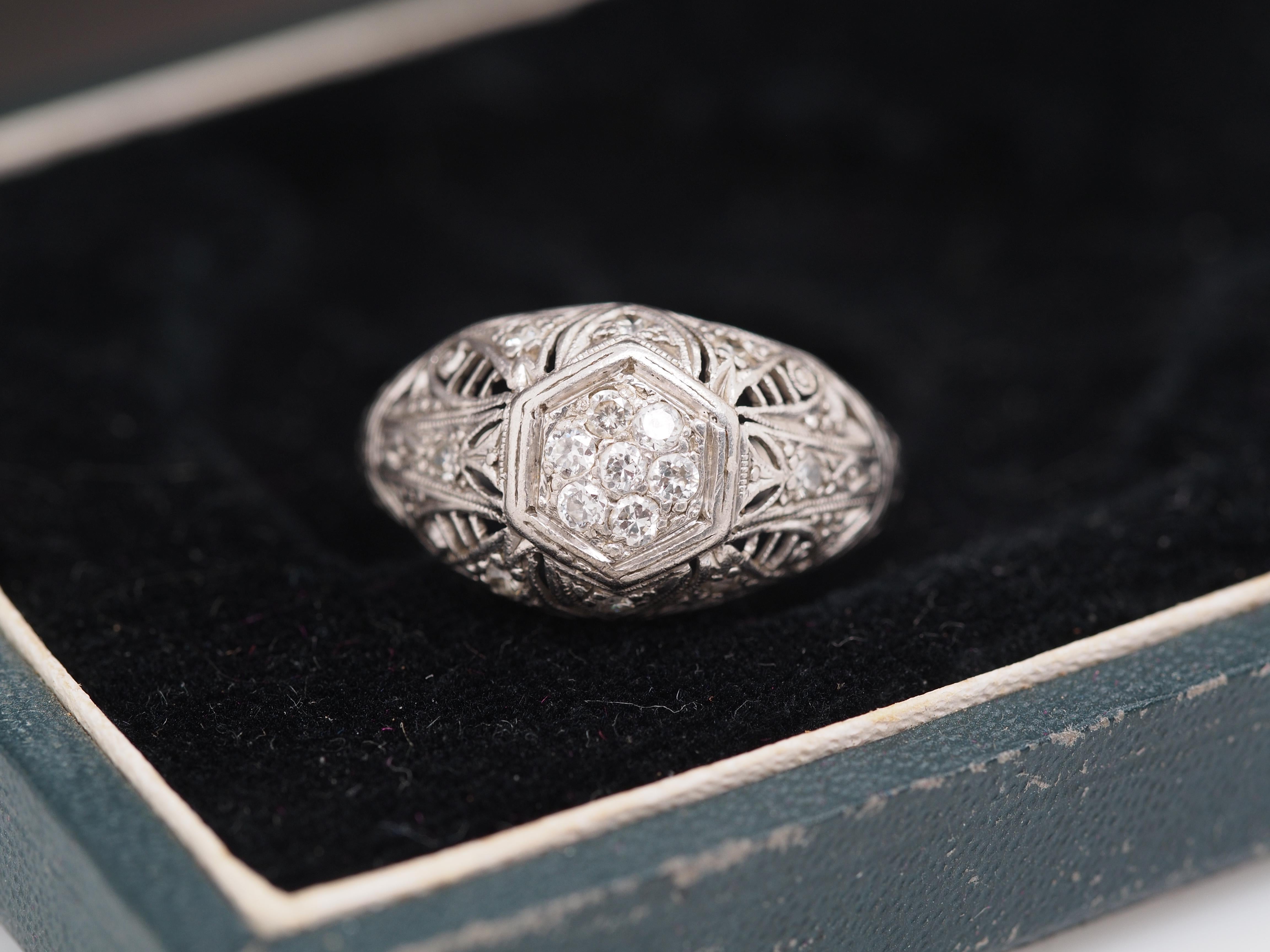 Year: 1920

Item Details:
Ring Size: 6.75
Metal Type: Platinum [Hallmarked, and Tested]
Weight: 4.2 grams

Diamond Details: Natural Diamonds, Old European Cut, .20ct total weight, G Color, VS Clarity

Band Width: 2.2 mm
Condition: Excellent

Price: