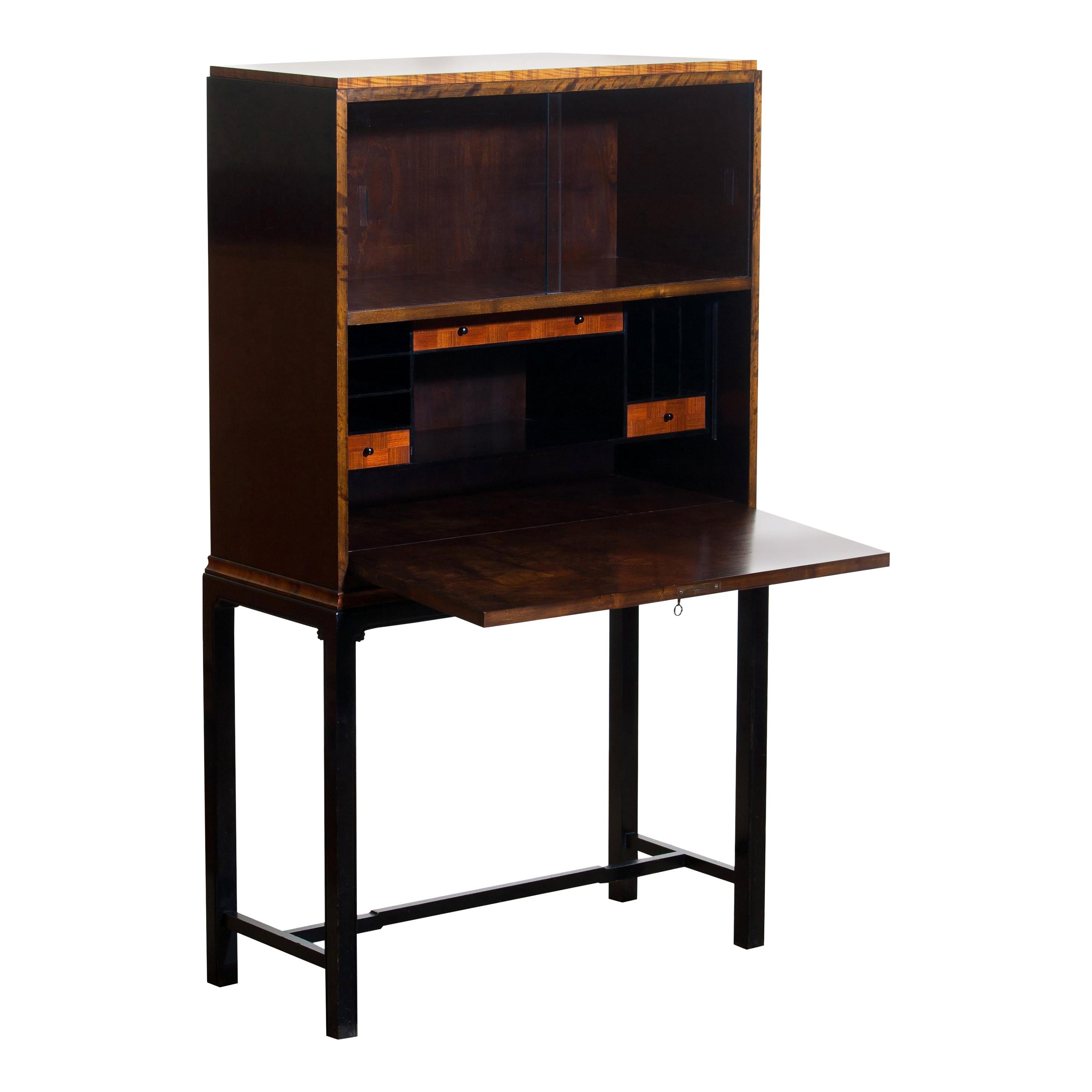1920s, unique secretaire designed by Axel Einar Hjorth and manufactured in 1924 by Nordiska Kompaniet, numbered L228.
This unique Art Deco secretaire is designed as an come-in to the USA for Nordiska Kompaniet.

The secretaire is veneered with