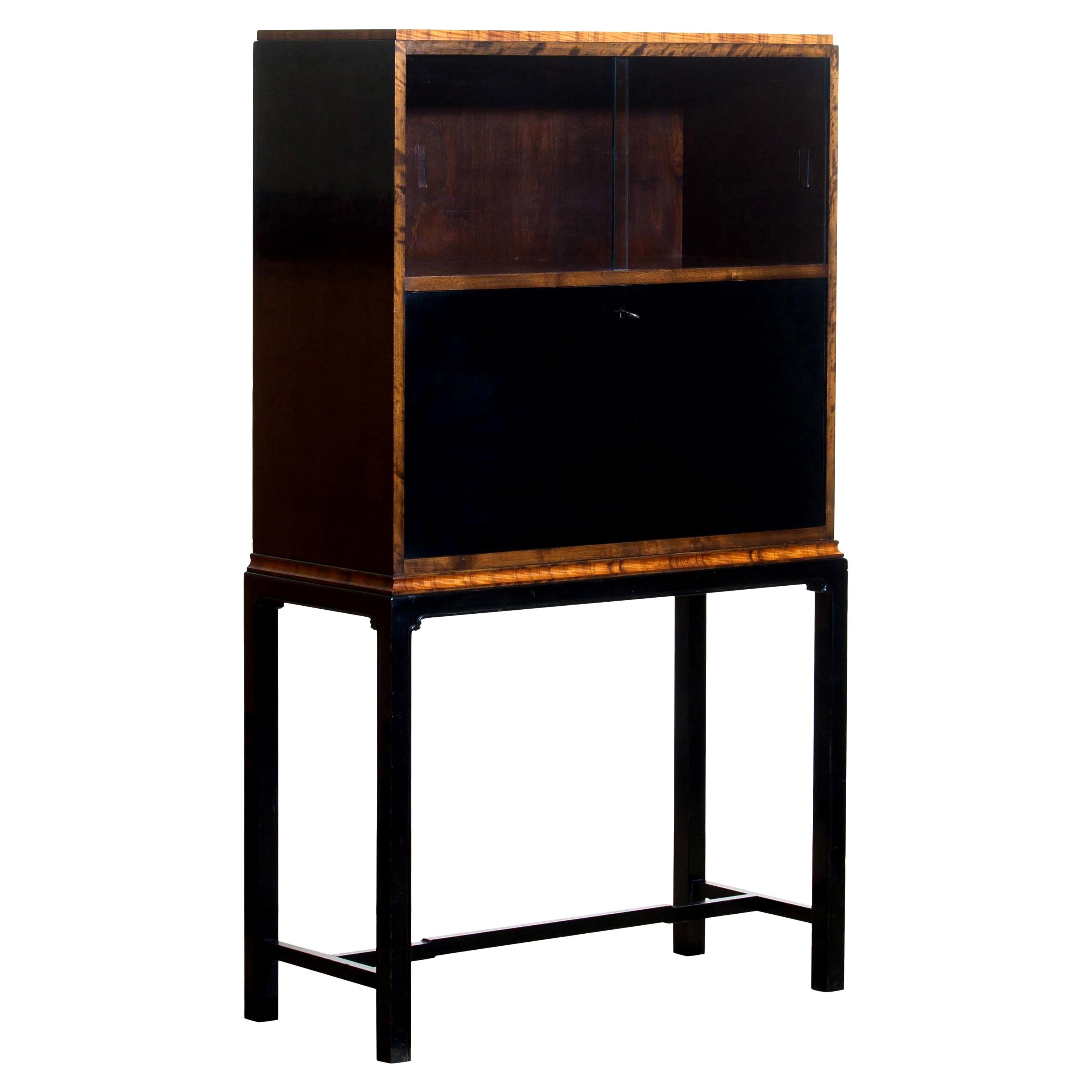 1920s, unique secretaire designed by Axel Einar Hjorth and manufactured in 1924 by Nordiska Kompaniet, numbered L228.
This unique Art Deco secretaire is designed as a come-in to the USA for Nordiska Kompaniet.

The secretaire is veneered with