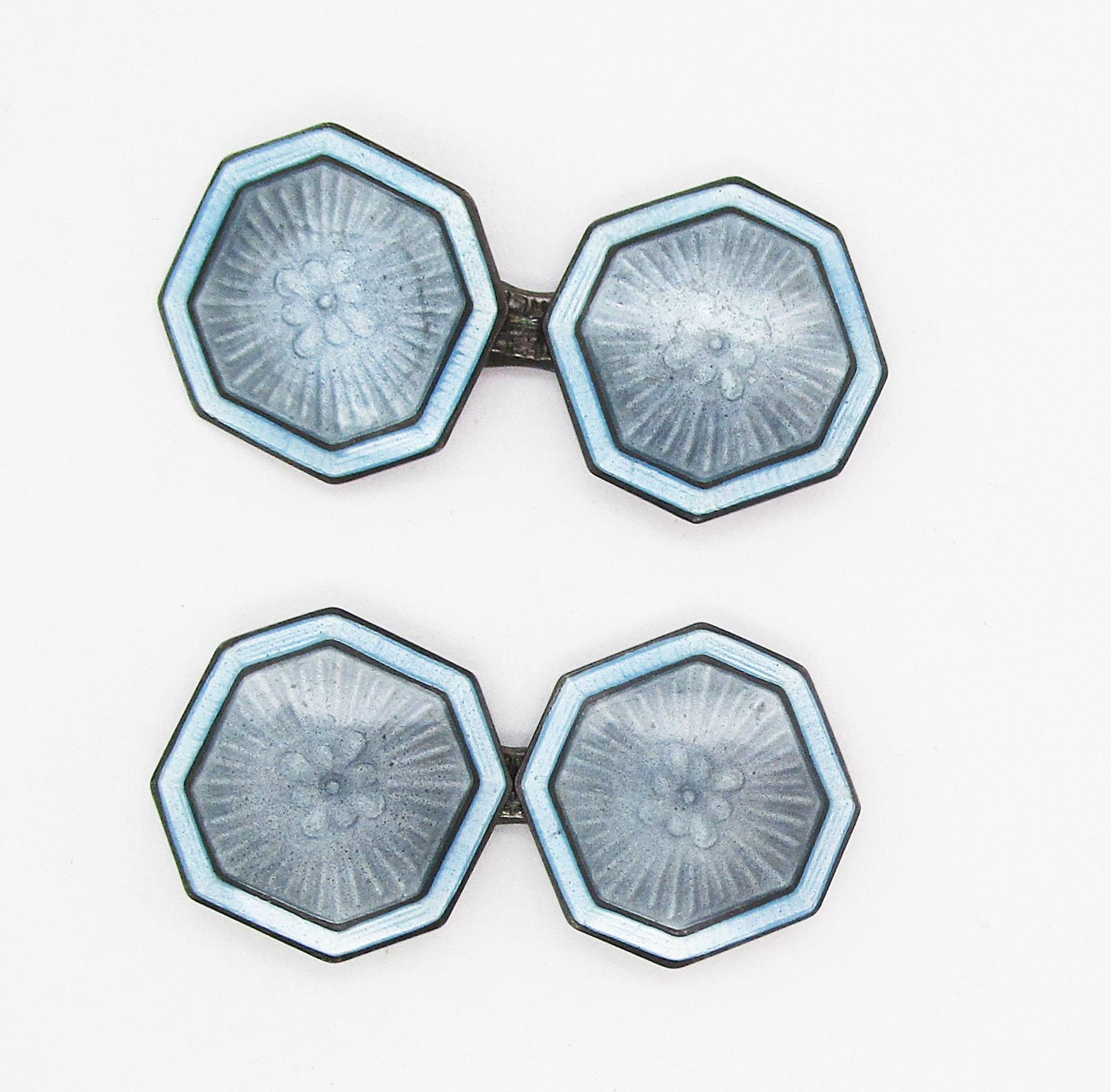 These fantastic cufflinks are from the Art Deco movement of the early 1920s and feature a great combination of sterling silver and pale blue enamel. The links have a unique cut-corner square shape that makes them stand out right away. The subtle