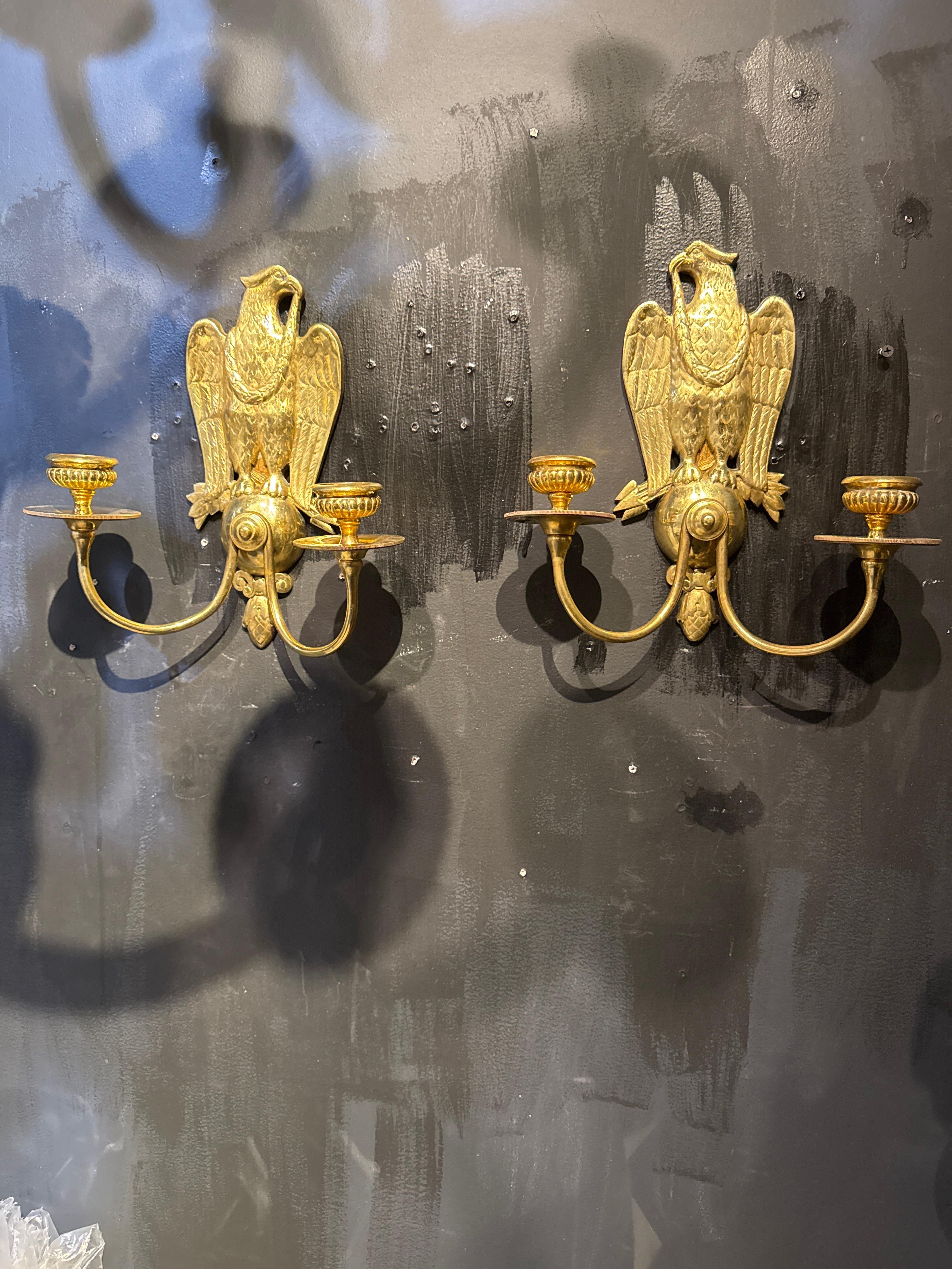 A pair of circa 1920’s gilt bronze federal style double arm sconces. Available in silver plate 