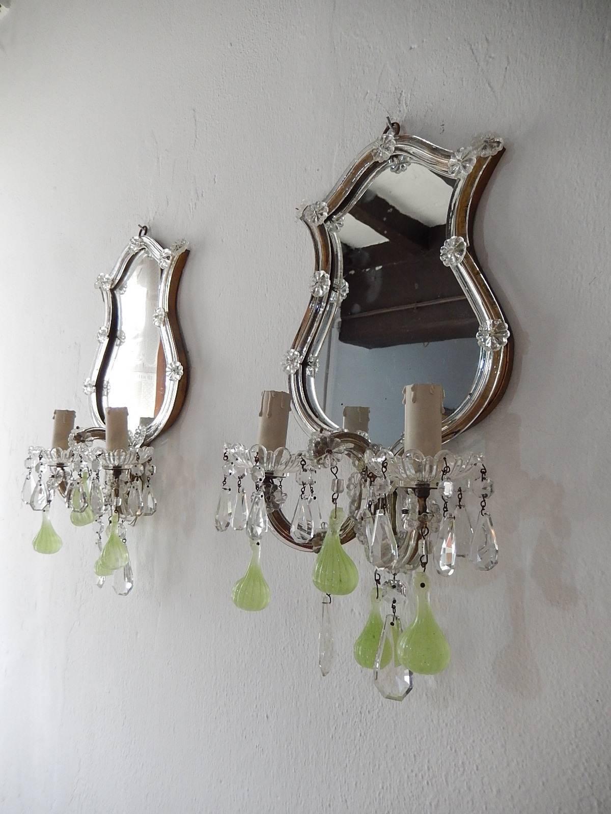 This set consists of four sconces, two with mirrors and two without. I have the matching nine-light chandelier as well. Gilt metal with Murano blown glass covering. Adorning rare chartreuse figs throughout and crystal prisms. The smaller sconces