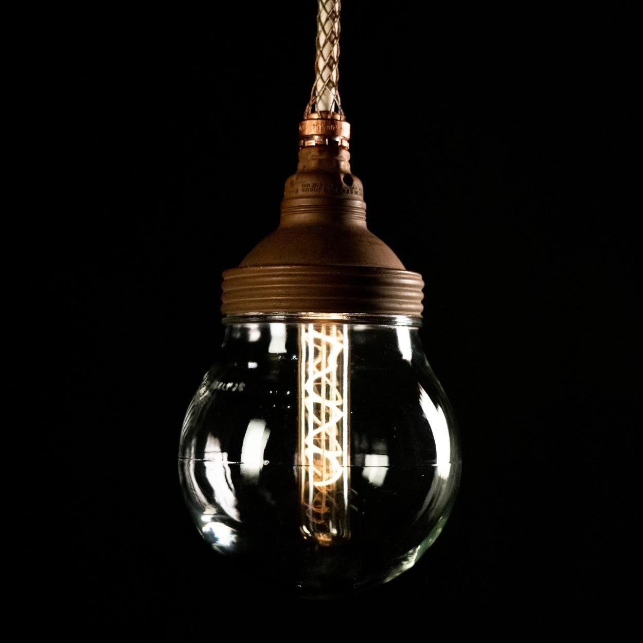 One of the more interesting industrial lights manufactured in the USA with decent gauge copper nicely patina'd with a thick glass globe... used predominantly in silos and areas where fumes could ignite a bulb they sealed perfectly .. a stylish 