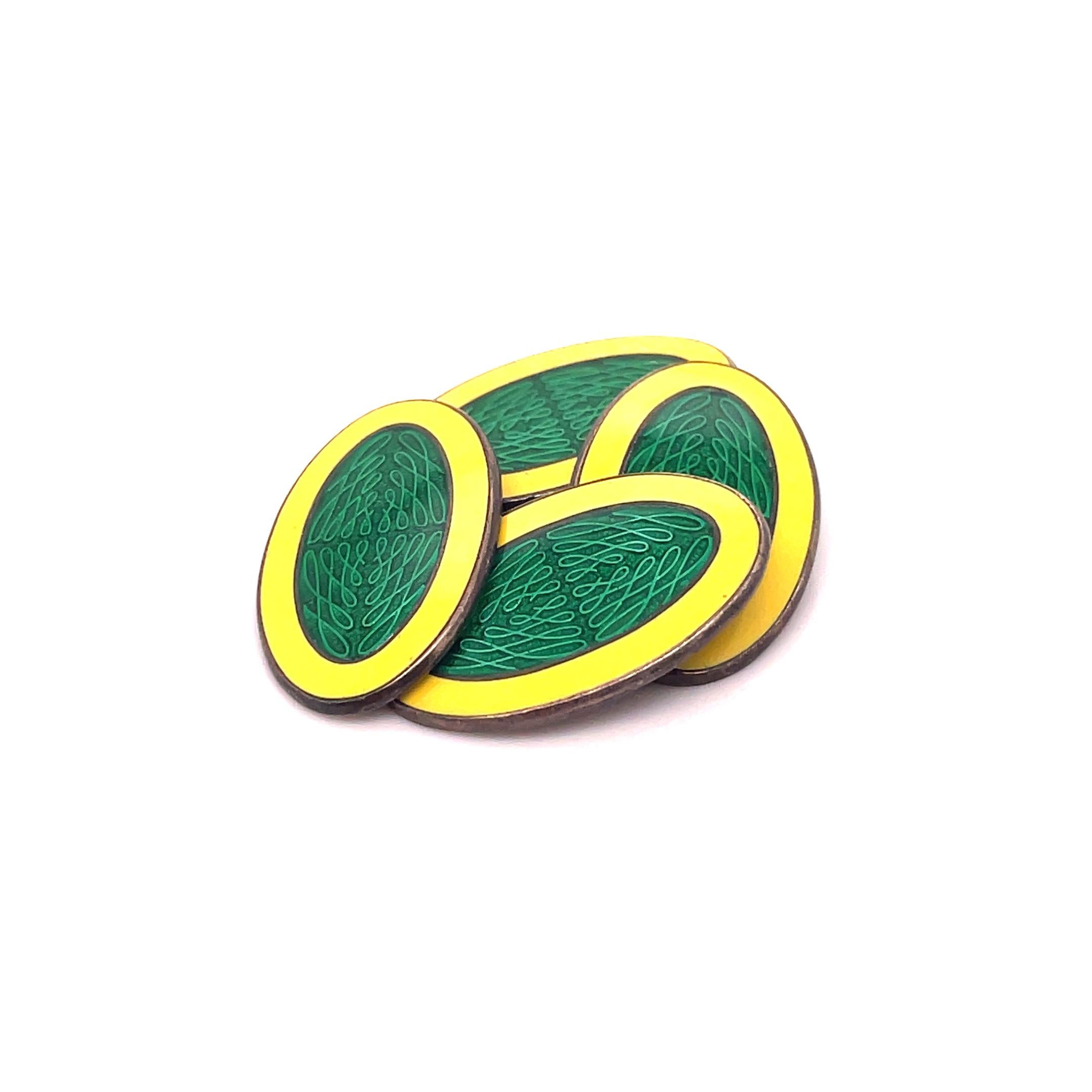 This is a remarkable pair of Art Deco cufflinks signed by Krementz that feature a stunning bright yellow frame and a strong dark green guilloche center. These cufflinks are signed by Krementz and marked Sterling. The shining yellow frame against the