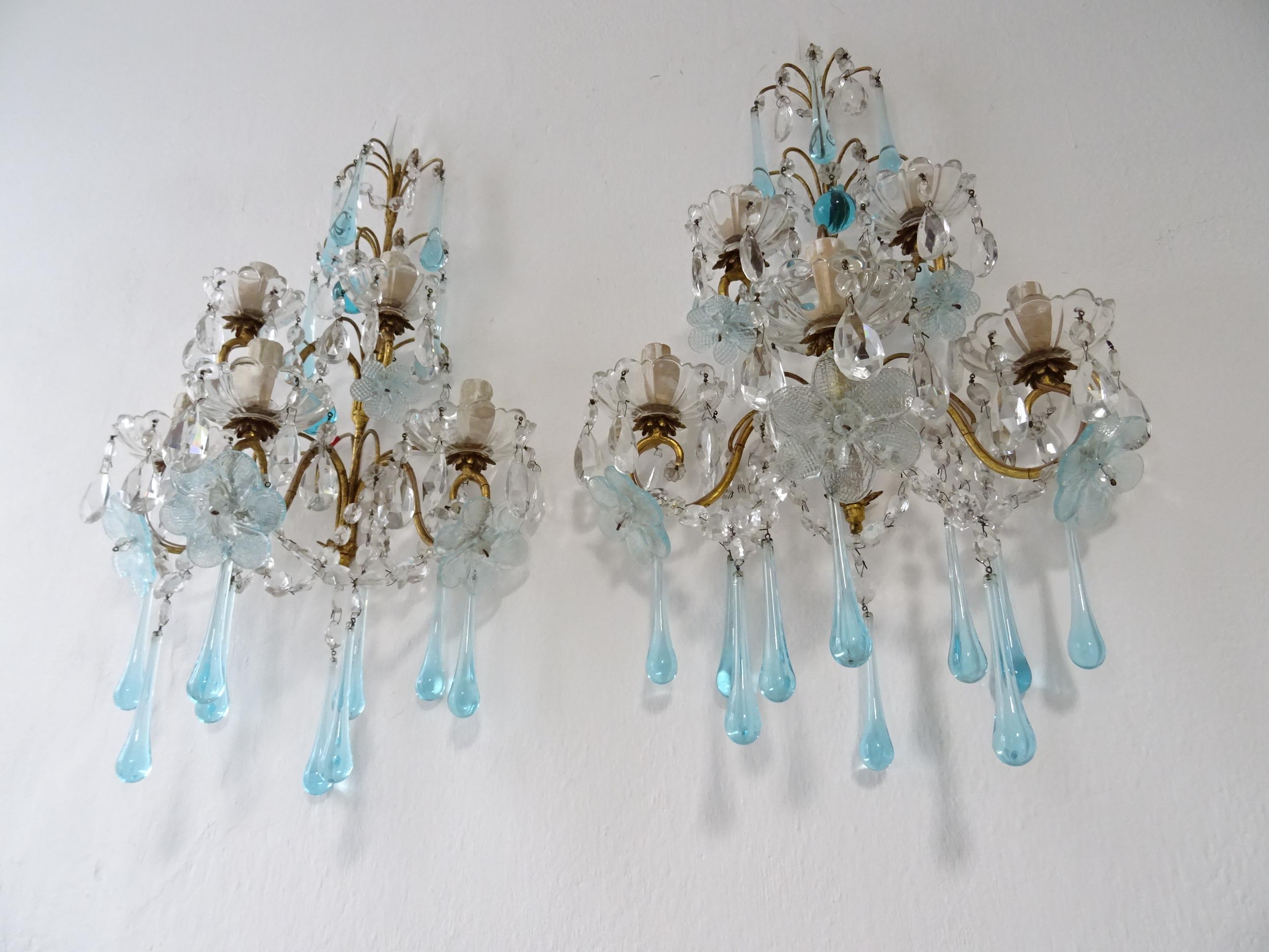Housing an impressive 5 lights each sitting in crystal bobeches dripping with crystals. Will be re wired with certified sockets appropriate for country and ready to hang. *UL US sockets for the USA.*Gilt metal body with swags of crystal prisms and