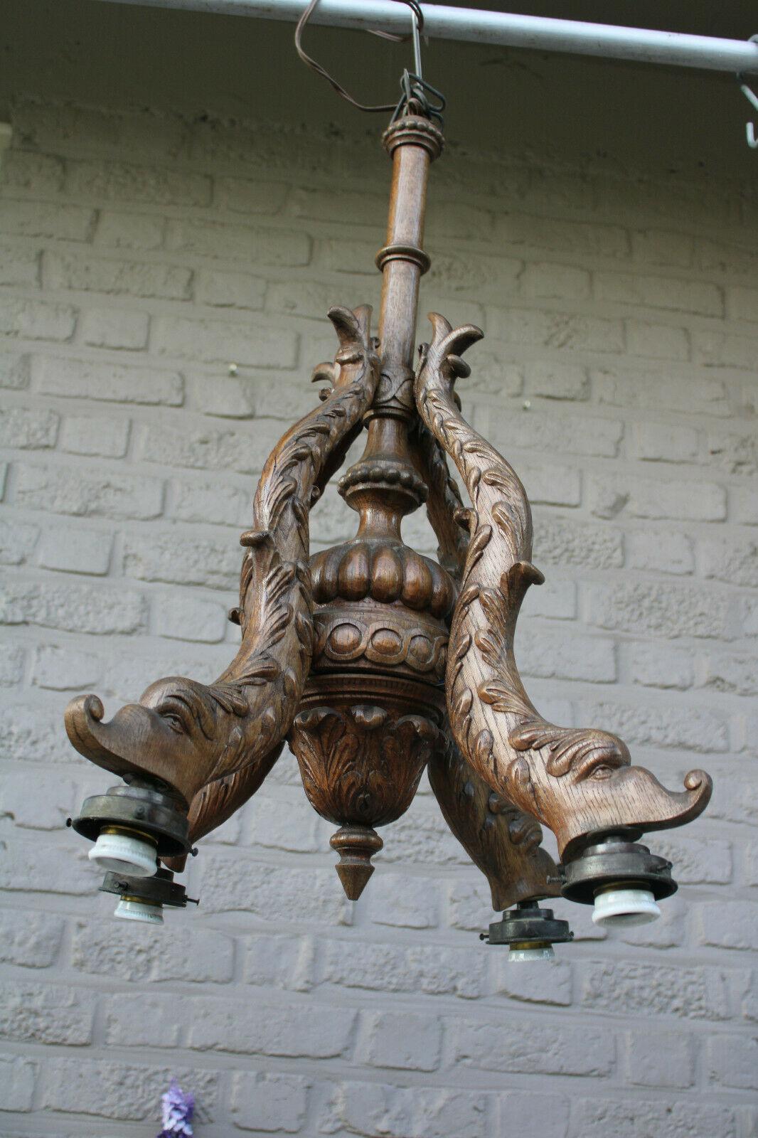 Stunning 1920s French Art Deco Expertly Carved Wood Koi/ Dolphin/ Sea Creature - Fish Chandelier. There are beautiful art glass flower shades included - they are dropping from the fish mouth - Beatiful! German estate acquisition.