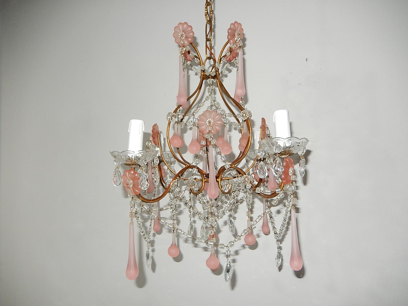 Housing four-light, sitting in crystal bobeches, dripping with vintage crystal prisms. Re-wired and ready to hang. Adorning fogged pink huge florets, matching Murano drops in two sizes, clear prisms with swags of macaroni beads and florets