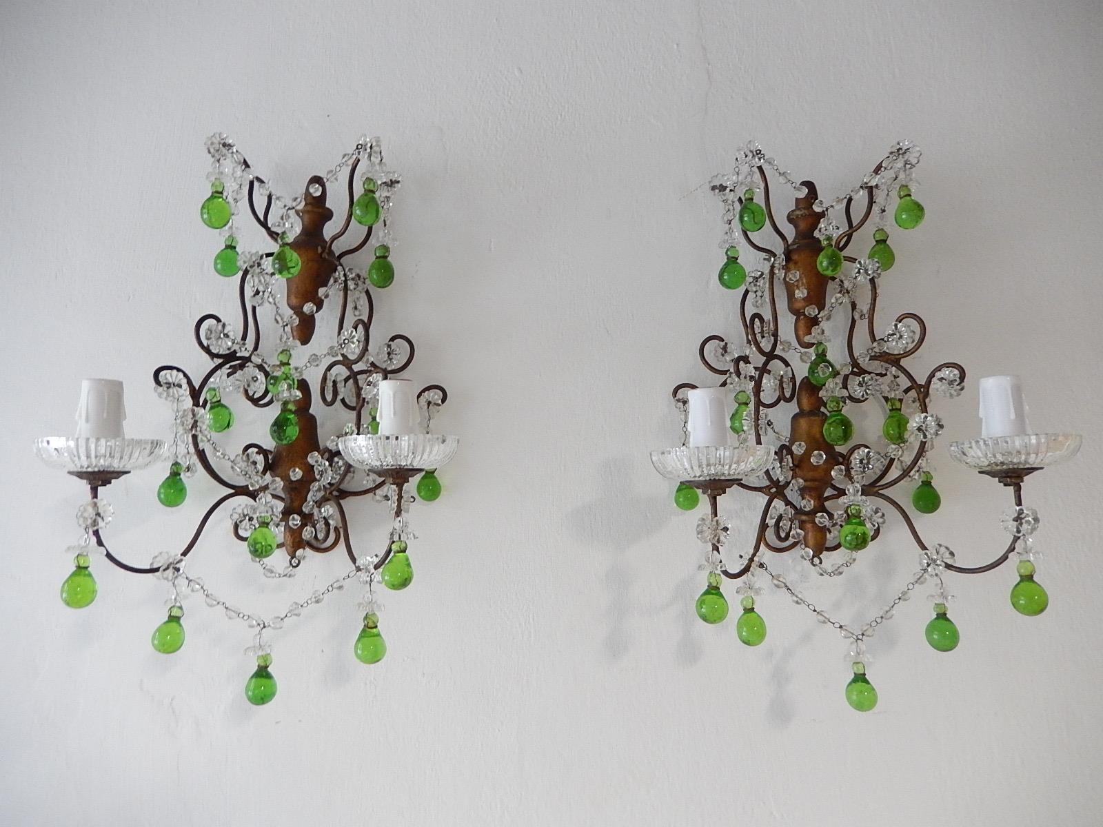 Will be rewired with certified US UL sockets for USA and appropriate sockets for all other countries and ready to hang. One of a kind pair! Housing 2 lights each, sitting in rare crystal bobéches dripping with vintage crystal prisms. Swags of