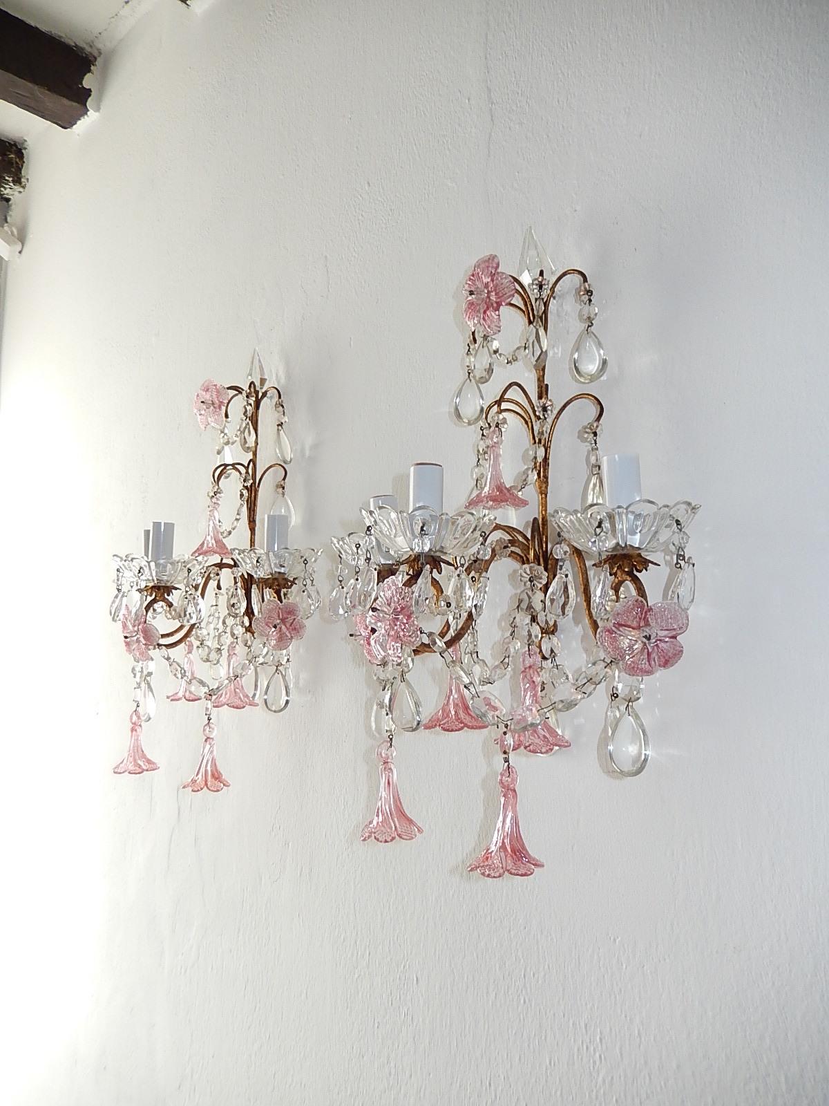 Housing three lights each sitting in crystal bobeches dripping with crystals. Will be re wired with certified sockets appropriate for country and ready to hang. Gilt metal body with swags of crystal and rare pink fuchsia Murano flowers and flower
