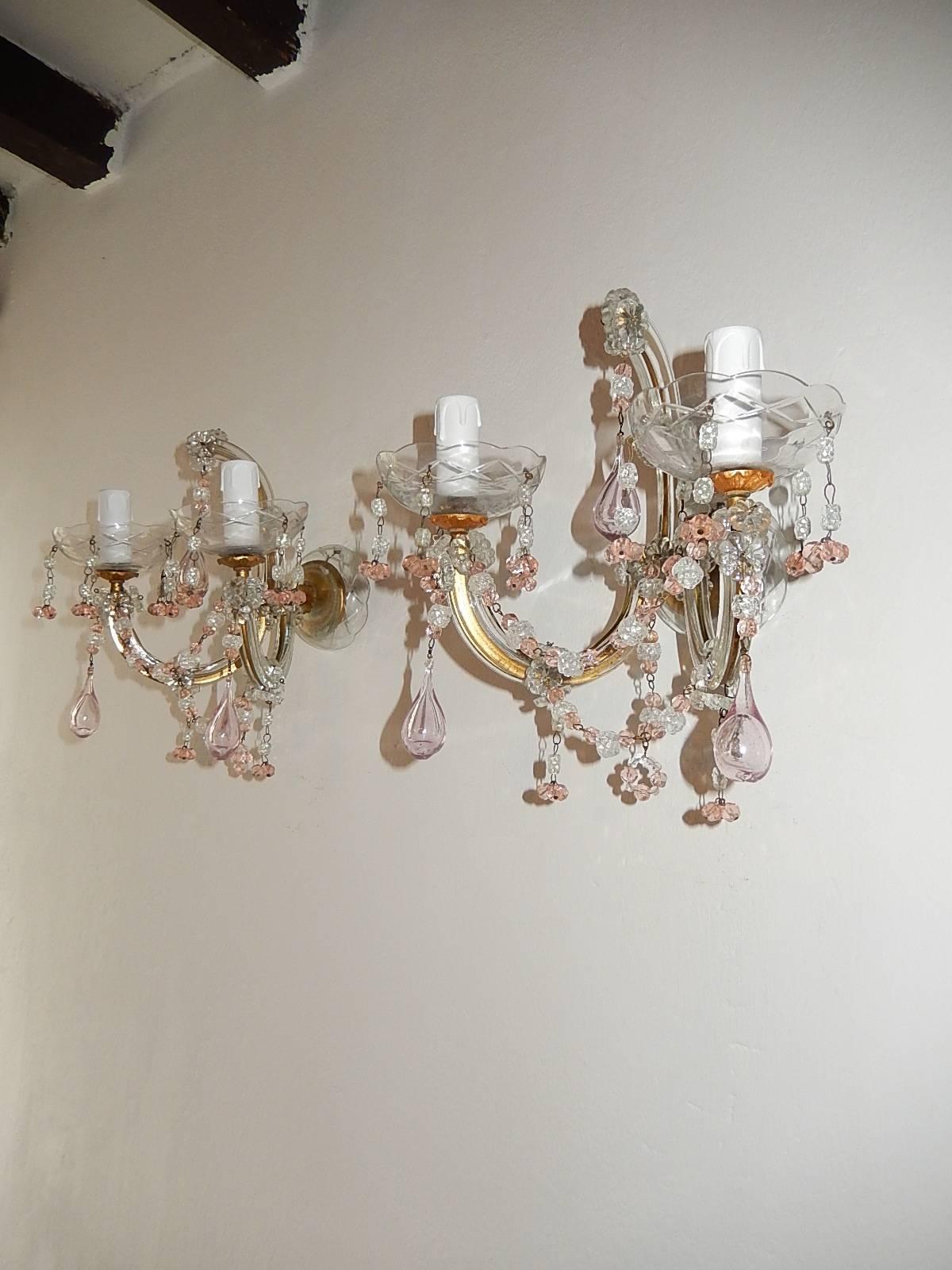 Housing two lights each. Rewired and ready to hang. Gilt metal arms with glass covering. Crystal bobeches with pink and white beads. Pink Blown Murano drops and swags of beads throughout. Free priority shipping from Italy.