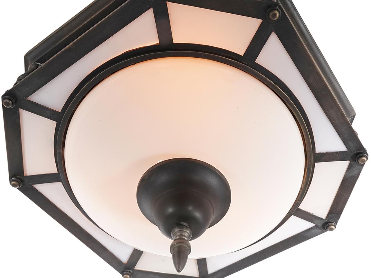 This is a very simple and elegant domed and paneled milk flush mounted lamp. You would most likely find this type of large ceiling fixture in a bank or municipal building. It has a center dome and 16 framed panels.