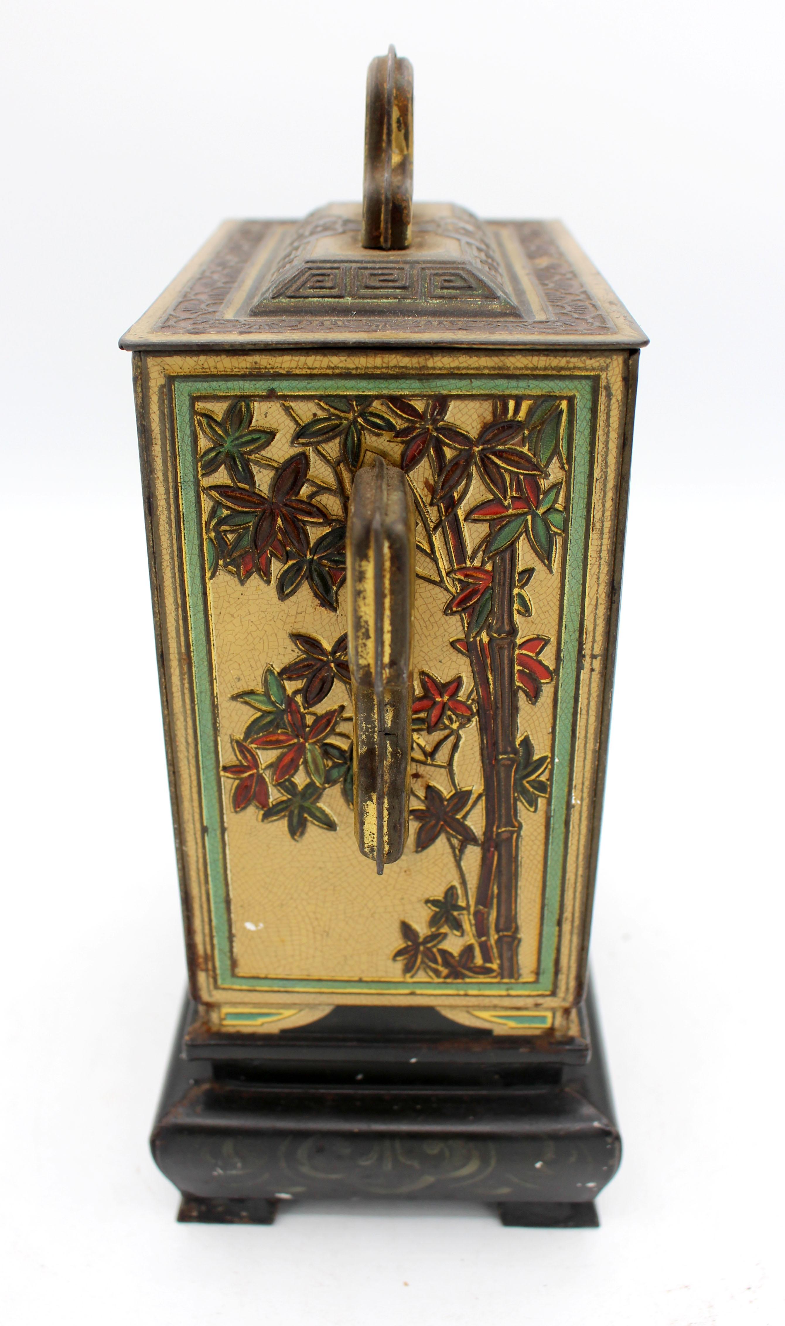 1920 Huntley & Palmers Chinoserie jar on stand form biscuit tin box. The sides are richly decorated with birds & flowers, bamboo, etc. Extensive bottom stamp lists the grand prize of 1878 & 1900 in Paris, etc. Identical to the example in the