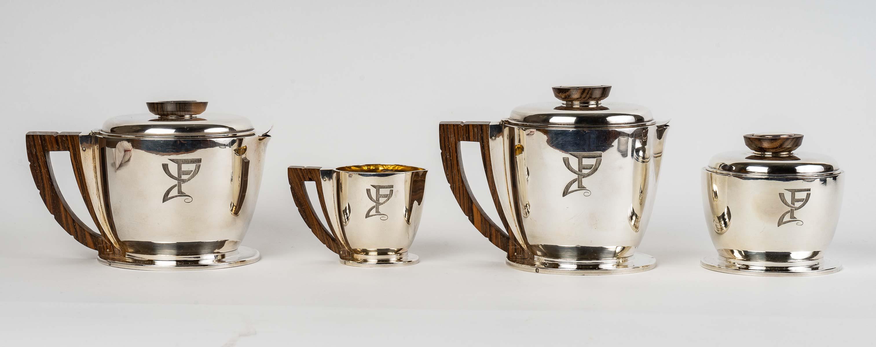 Tea and coffee service in sterling pure silver and macassar by Jean E. Puiforcat created in the 1920s.

Service including:
- a coffee pot : 11 cm x 10 cm
- a teapot : 10 cm x 9.5 cm
- a milk-pot : 5.5 cm x 5.5 cm
- a sugar pot : 8 cm x 8