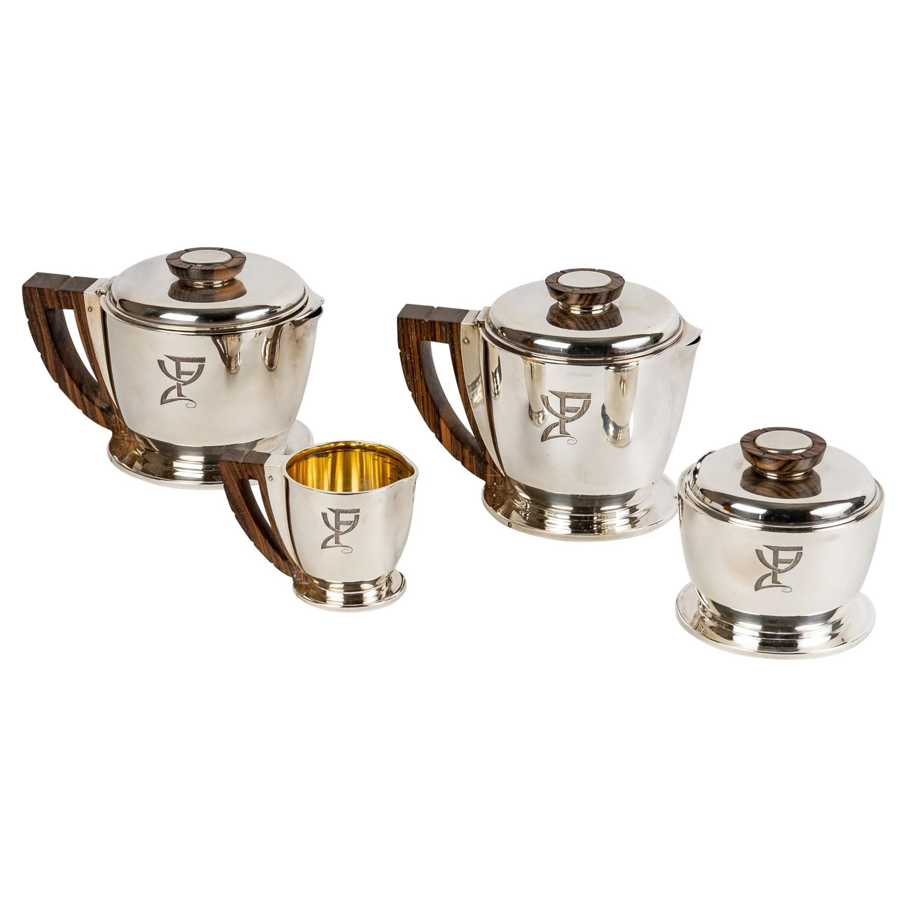 1920 Jean E. Puiforcat, Tea and Coffee Service in Sterling Silver and Macassar