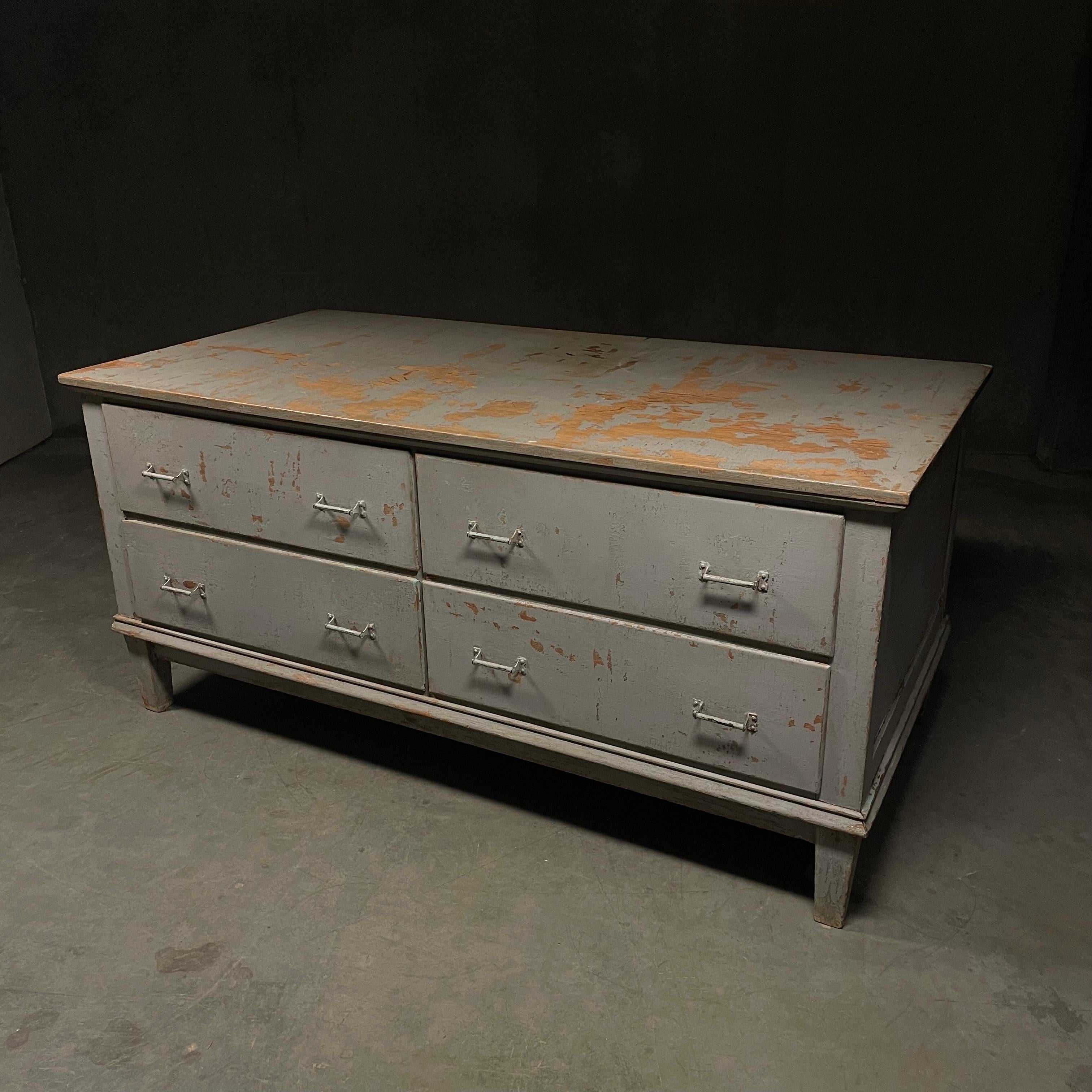 A great original working counter  from a Tailor shop in eastern USA. retains old ;polychrome grey surface  has multiple finished panel sides and four working deep drawers. 
this piece was found in a tailor shop in upper NY .

it currently sits a t