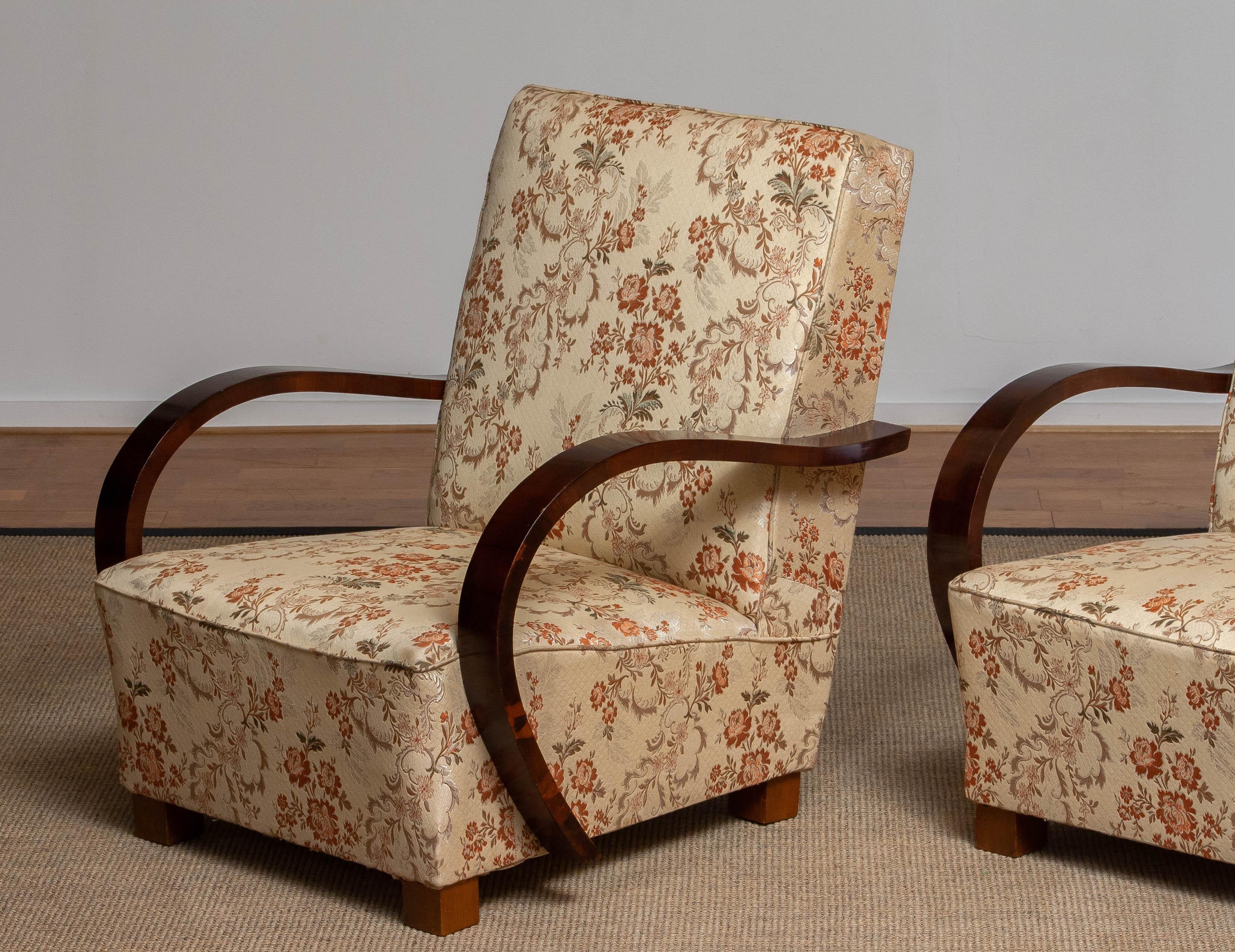 Beautiful set of two Swedish Art Deco arm, club or lounge club chairs from the 1920's. in walnut with luxury (later) jacquard fabric. Both chairs are in overall good condition.

Please note!
Because Shipping Costs highly fluctuate daily, we kindly