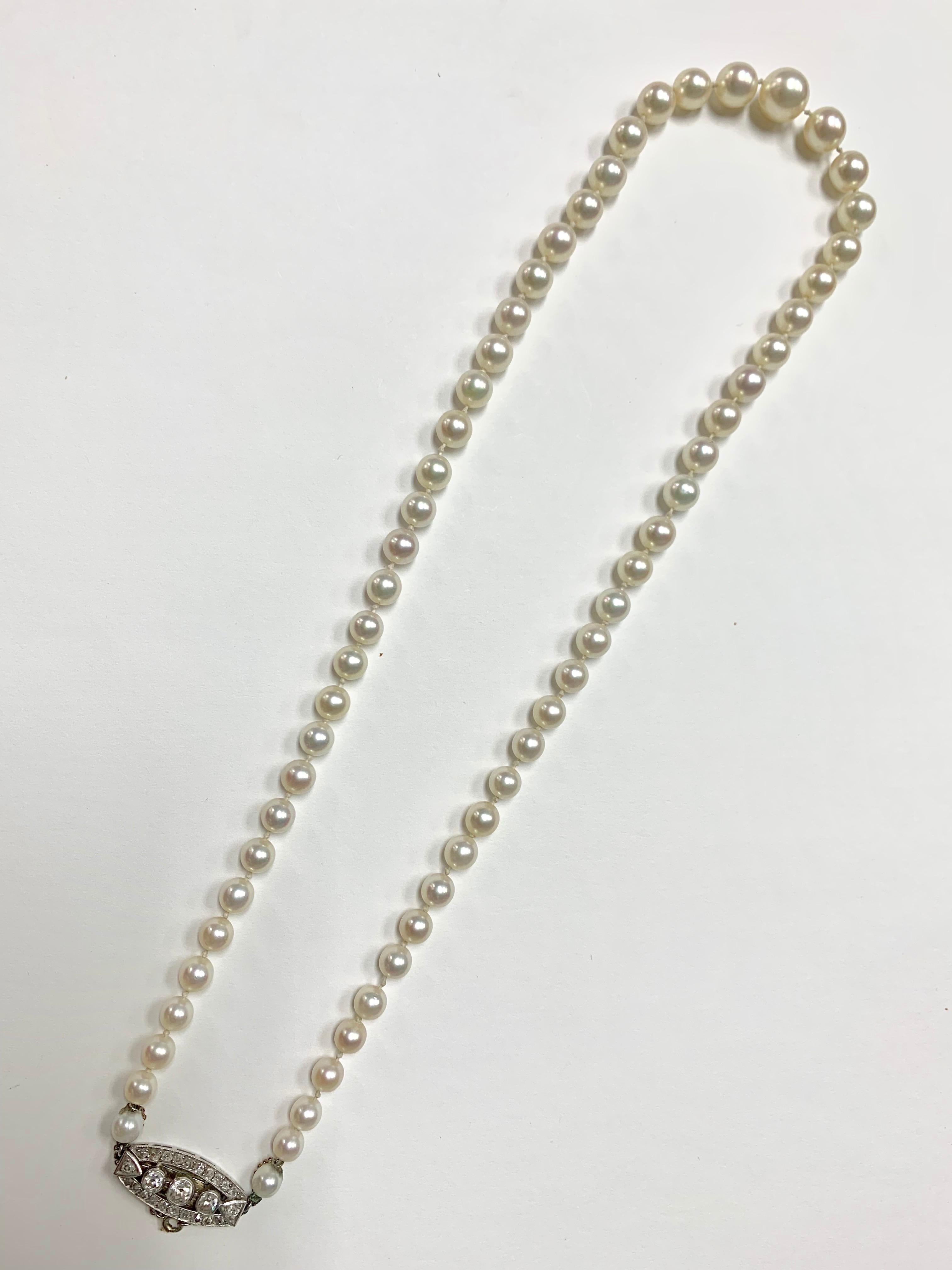 1920 Akoya Cultured Pearl and diamond necklace in platinum. 
Length- 19 inches 
Not pearls - 61 drilled pearls. 
61 pearls are drilled in a graduated necklace with a white metal clasp ( platinum ) set with numerous old european brilliants and single