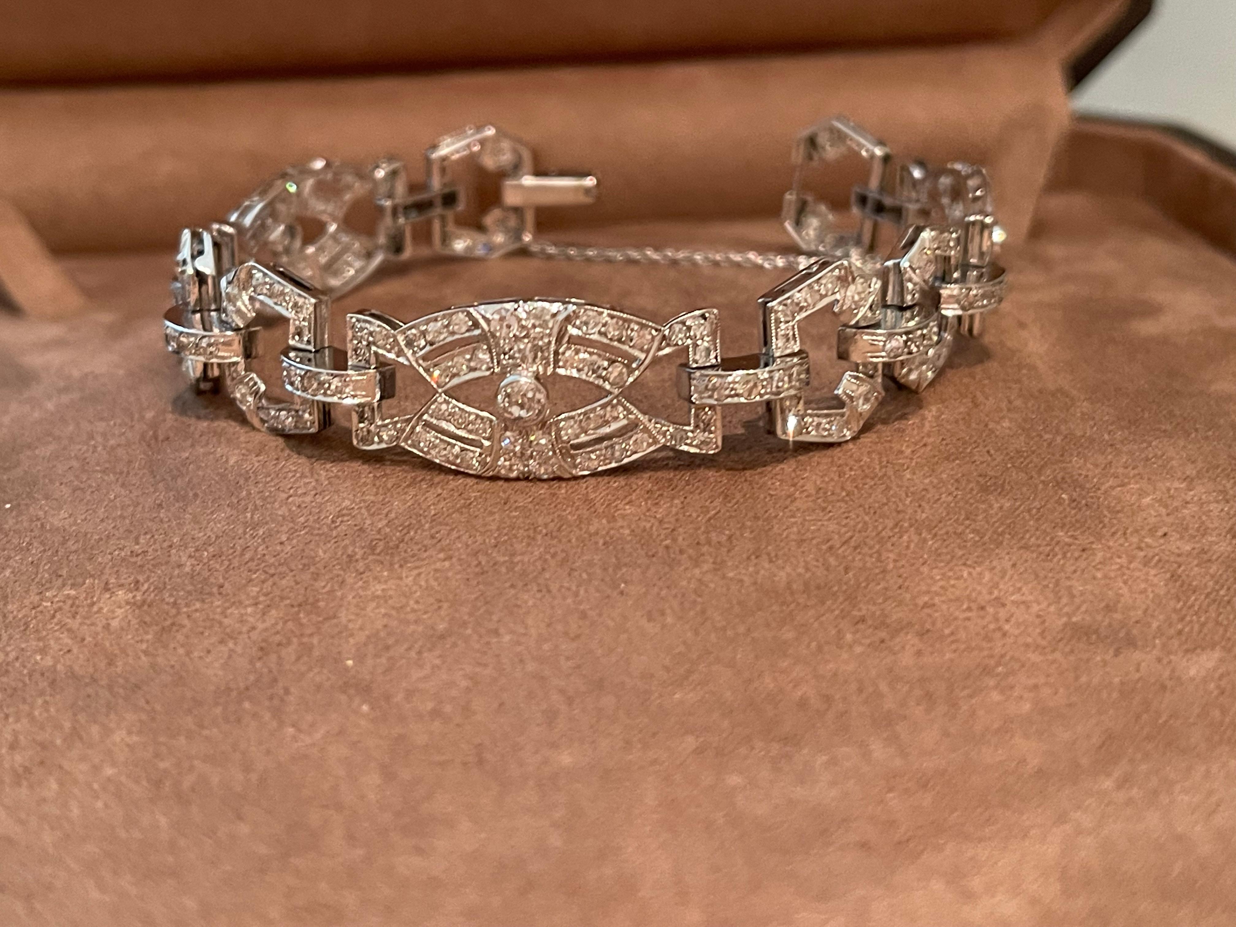 A gorgeous Art Deco diamond bracelet set in platinum. 
This particular piece is a perfect example of Art Deco craftsmanship and elegance! The bracelet is designed as an openwork panel featuring diamond set plaque links. The plaque links are  fully