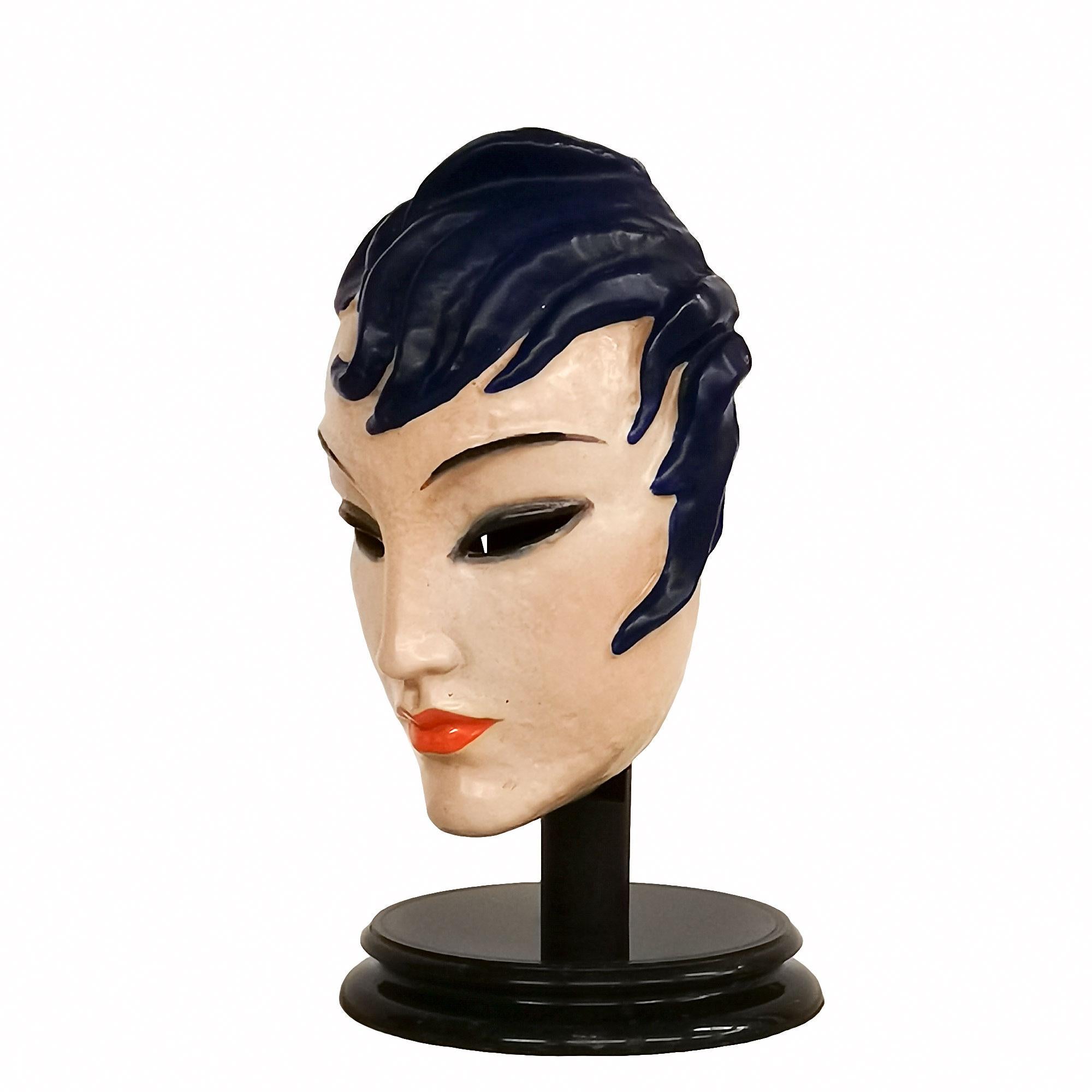 Art Deco woman face mask, enameled ceramic with a wood suppport and a marble base.
Production Keramos
Signed 